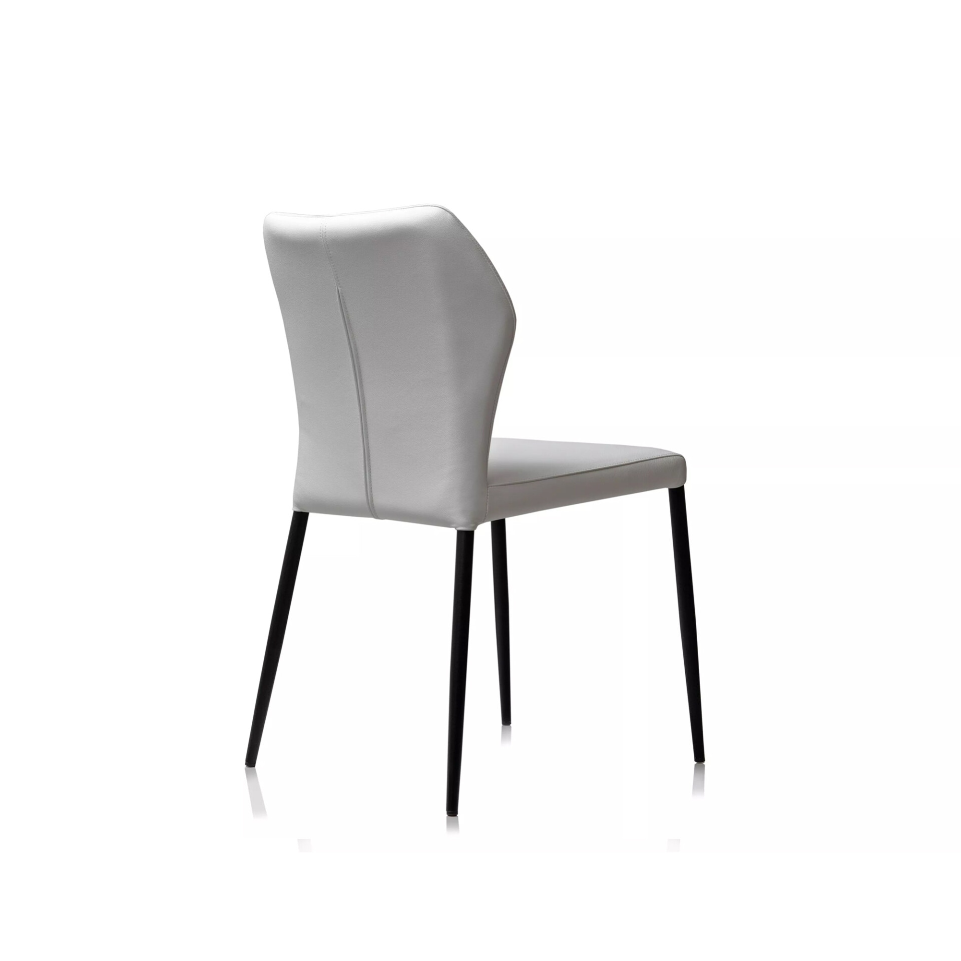 A light grey modern dining chair with black tapered legs, viewed from a three-quarter rear angle against a white background.