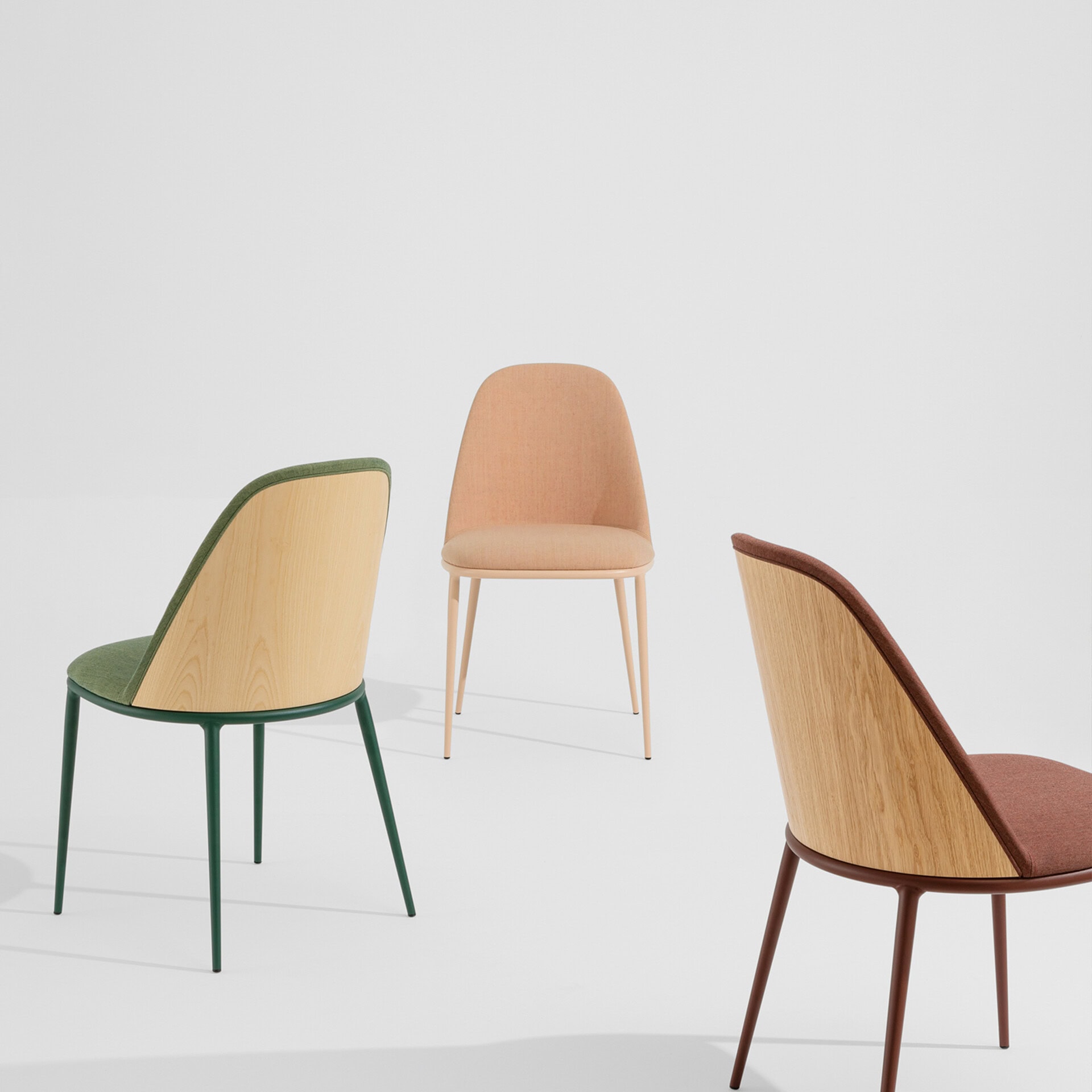 Stylish wooden chairs with upholstered seats in pastel colors for contemporary dining spaces.