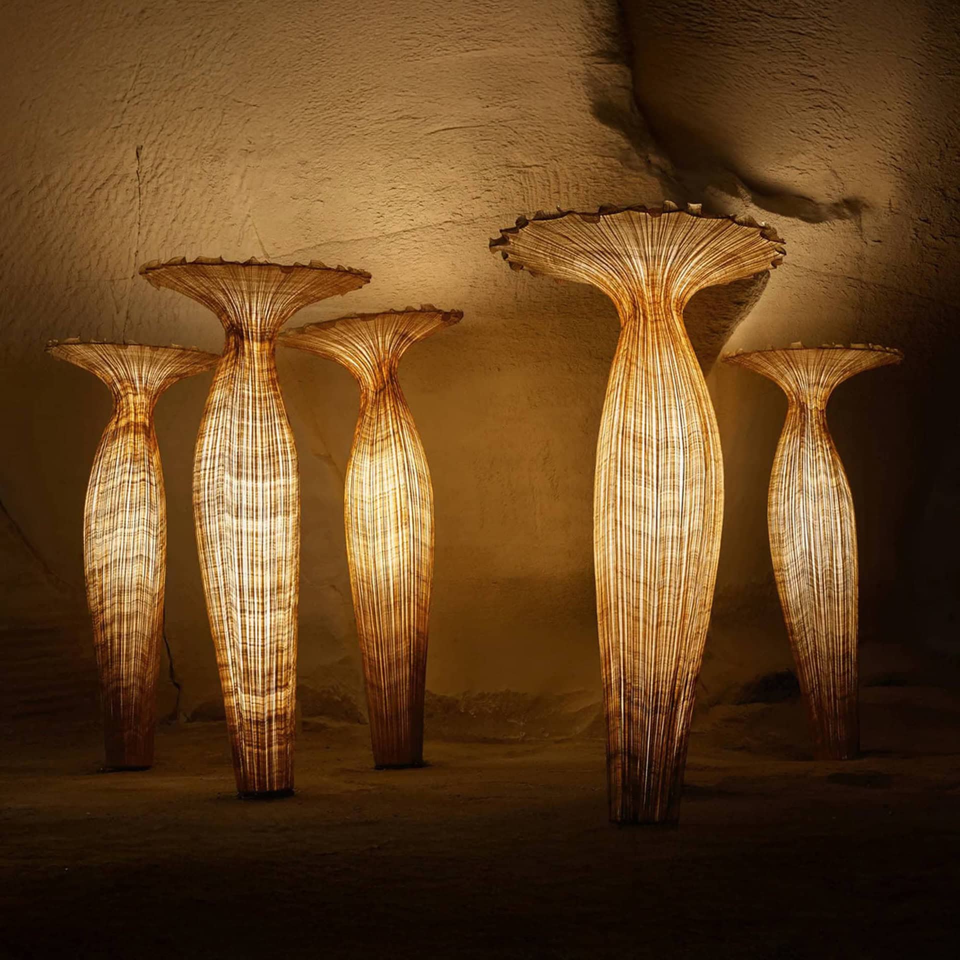 Elegantly crafted pendant lamps with woven rattan design, warm ambient lighting for sophisticated interiors.