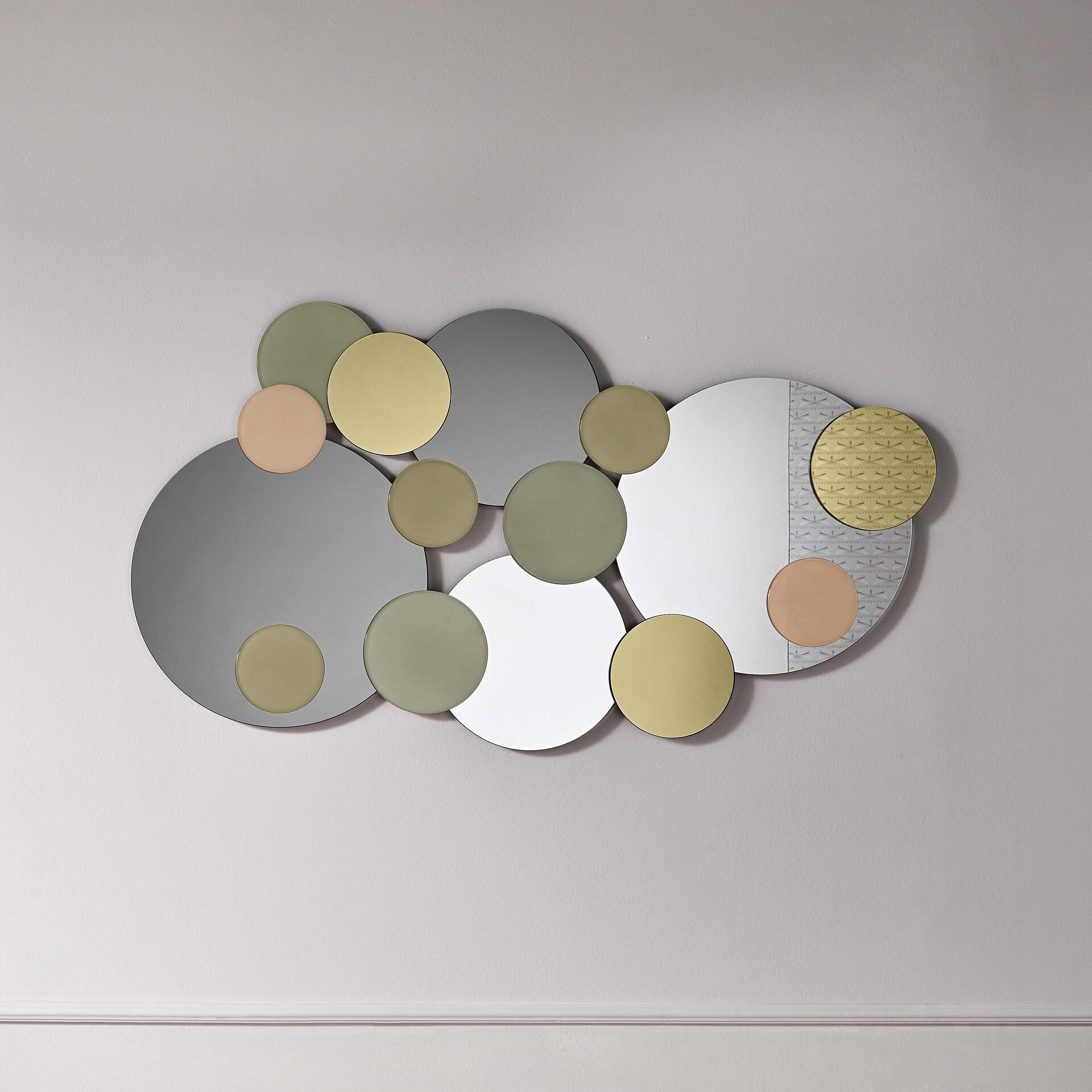Atomic Sculptural Wall Mirror with geometric circles in muted tones.