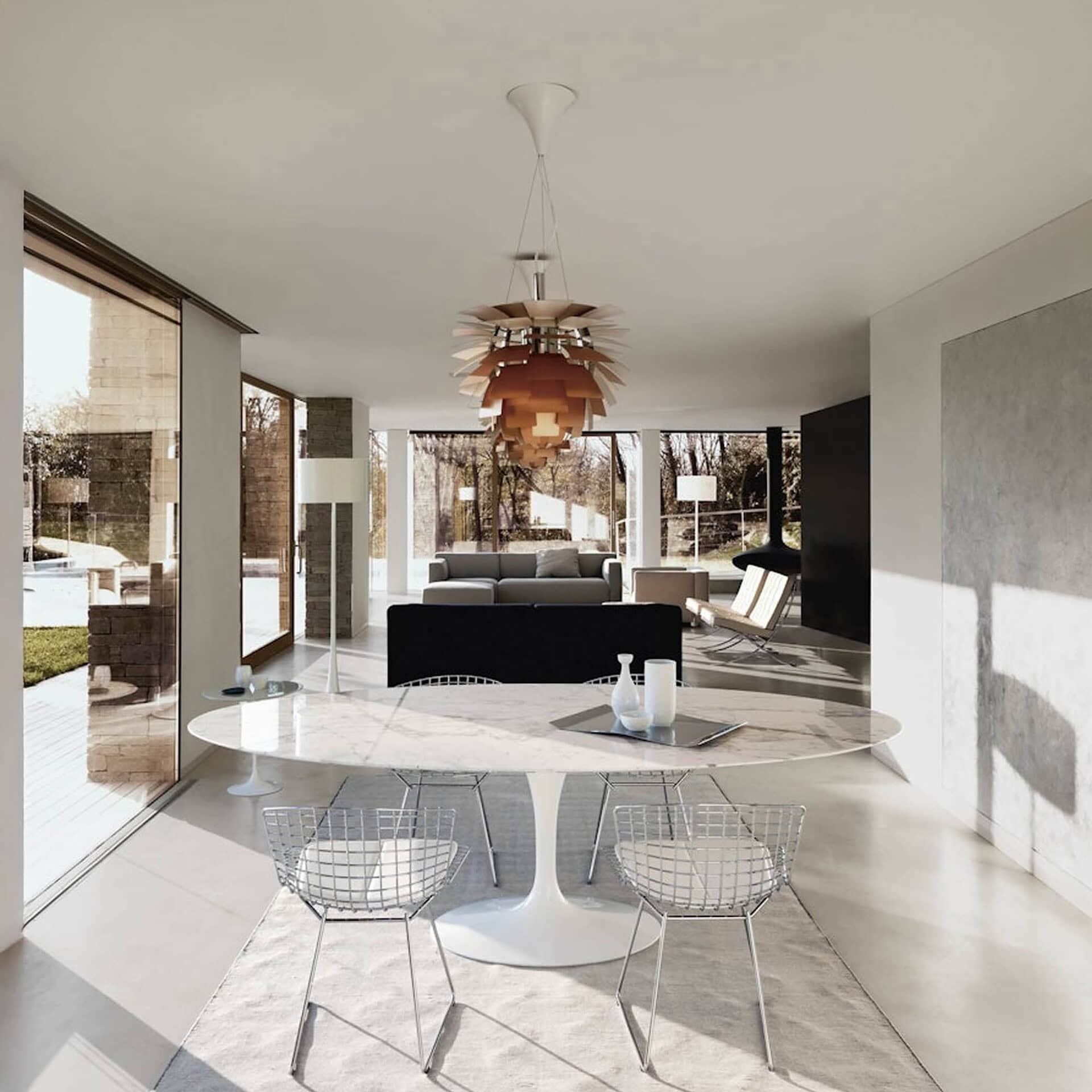 Large oval Saarinen Dining Table in a contemporary open-plan dining area.