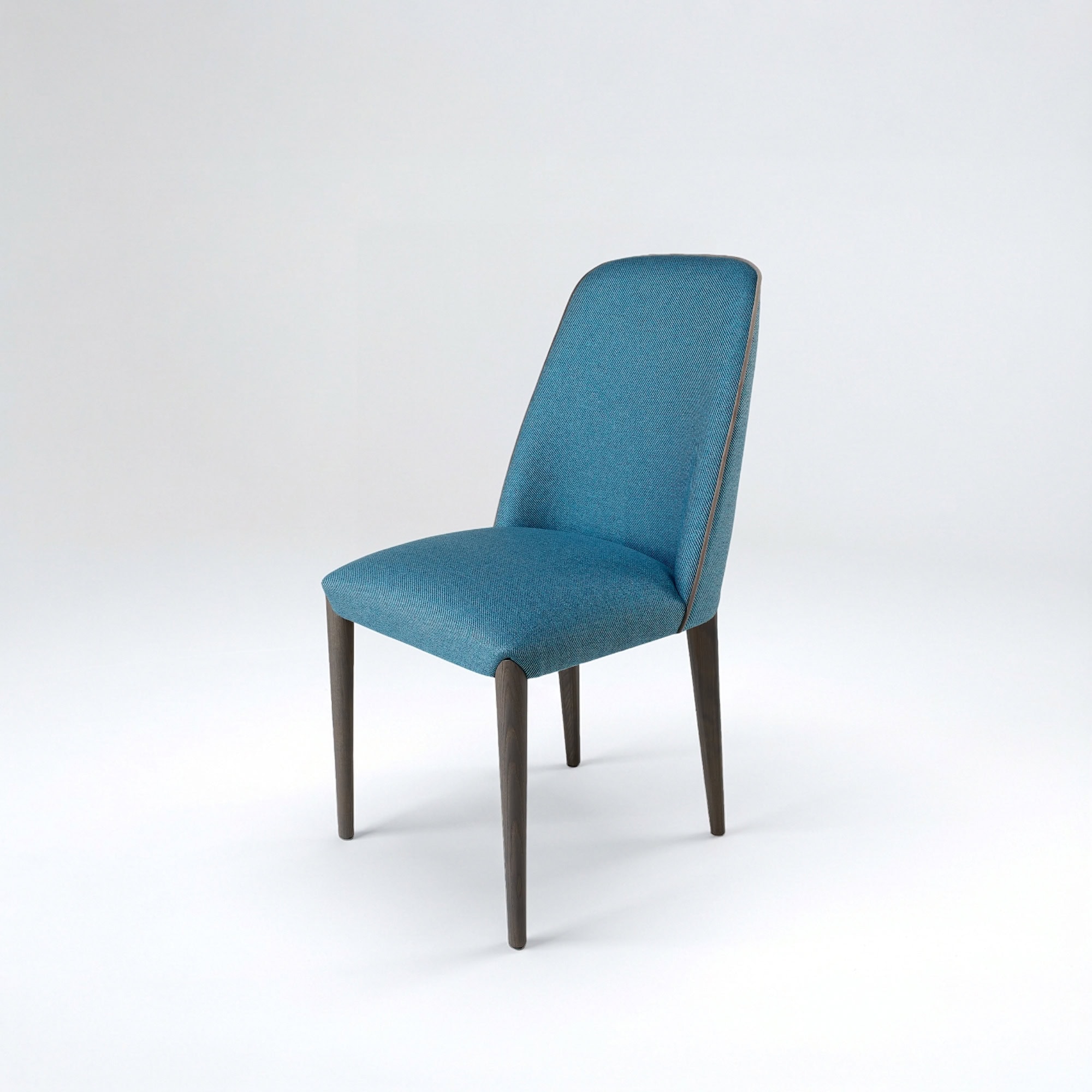 A modern teal upholstered dining chair with dark wooden legs and light brown piping, set against a light gray background.