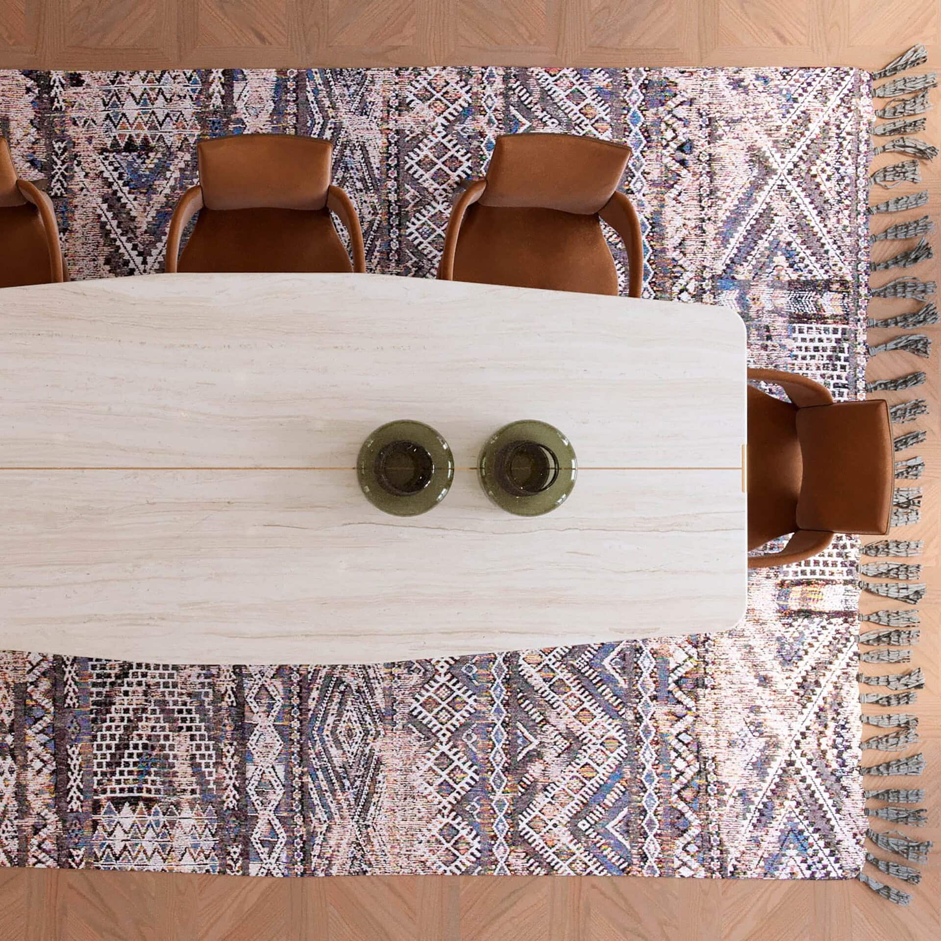 Overhead view of Jasmine Modern Dining Table showcasing marble surface with decorative centerpieces.