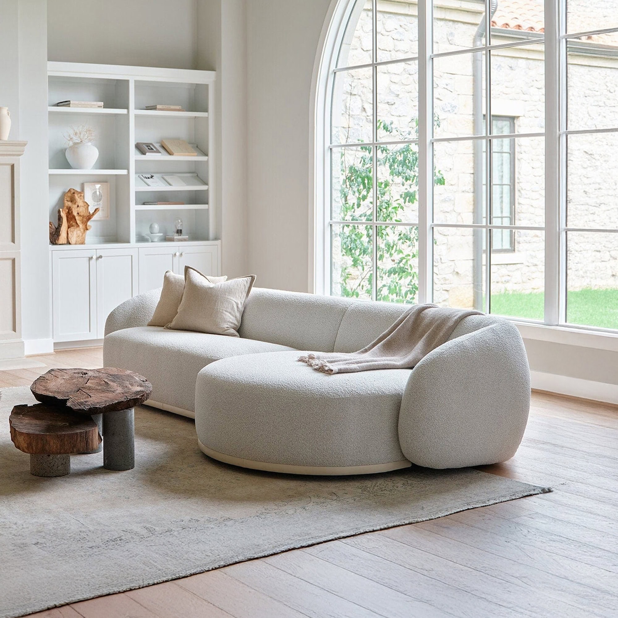 Athlea Sofa styled in a bright living room with natural light and neutral décor.
