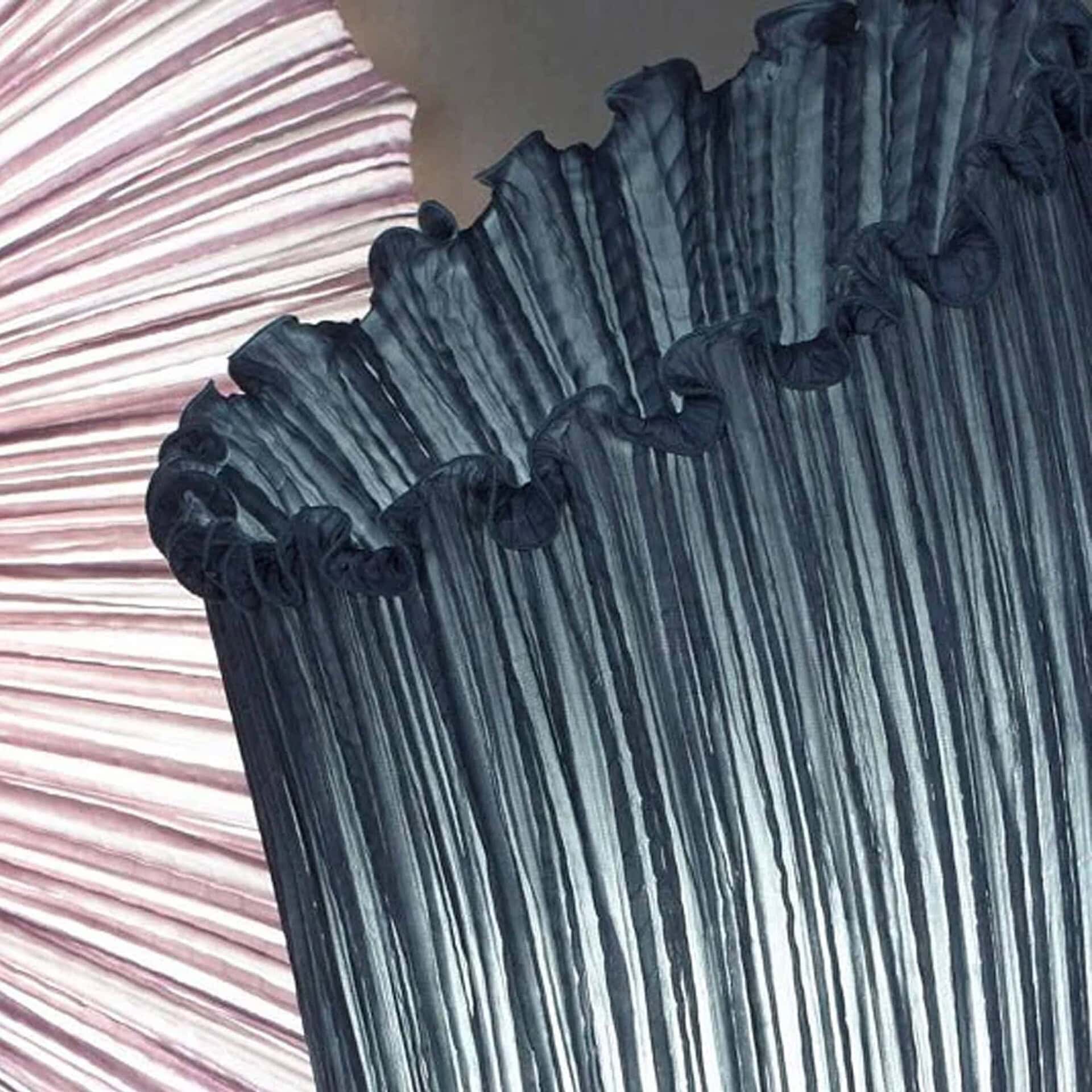 Close-up detail of Aqua Creations Horn Silk Floor Lamp in blue silk finish showing fabric texture.