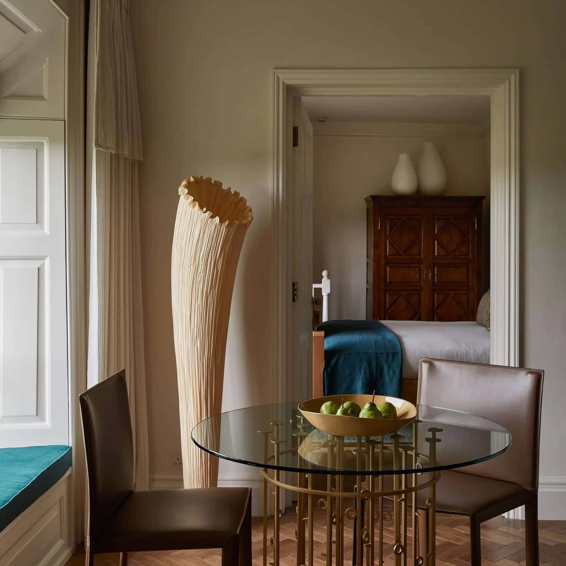 Aqua Creations Horn Silk Floor Lamp placed beside a modern armchair in a cozy corner.
