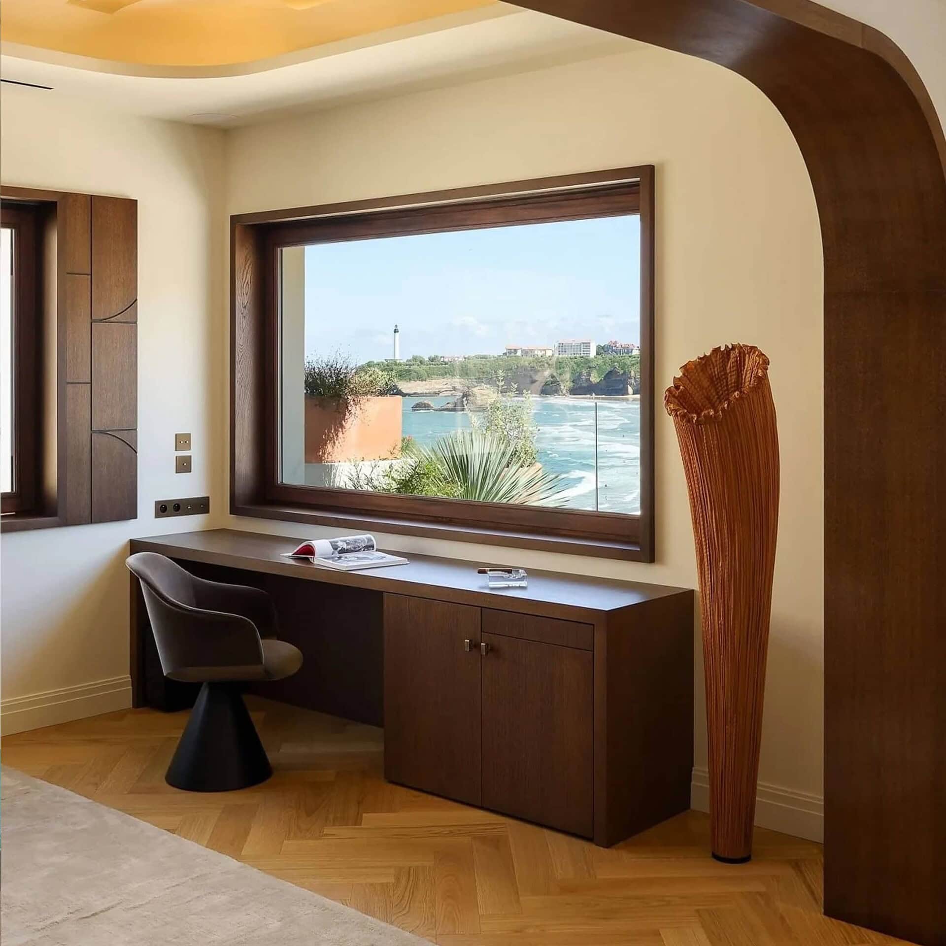 Aqua Creations Horn Silk Floor Lamp with silk shade featured in a warm, contemporary living room.