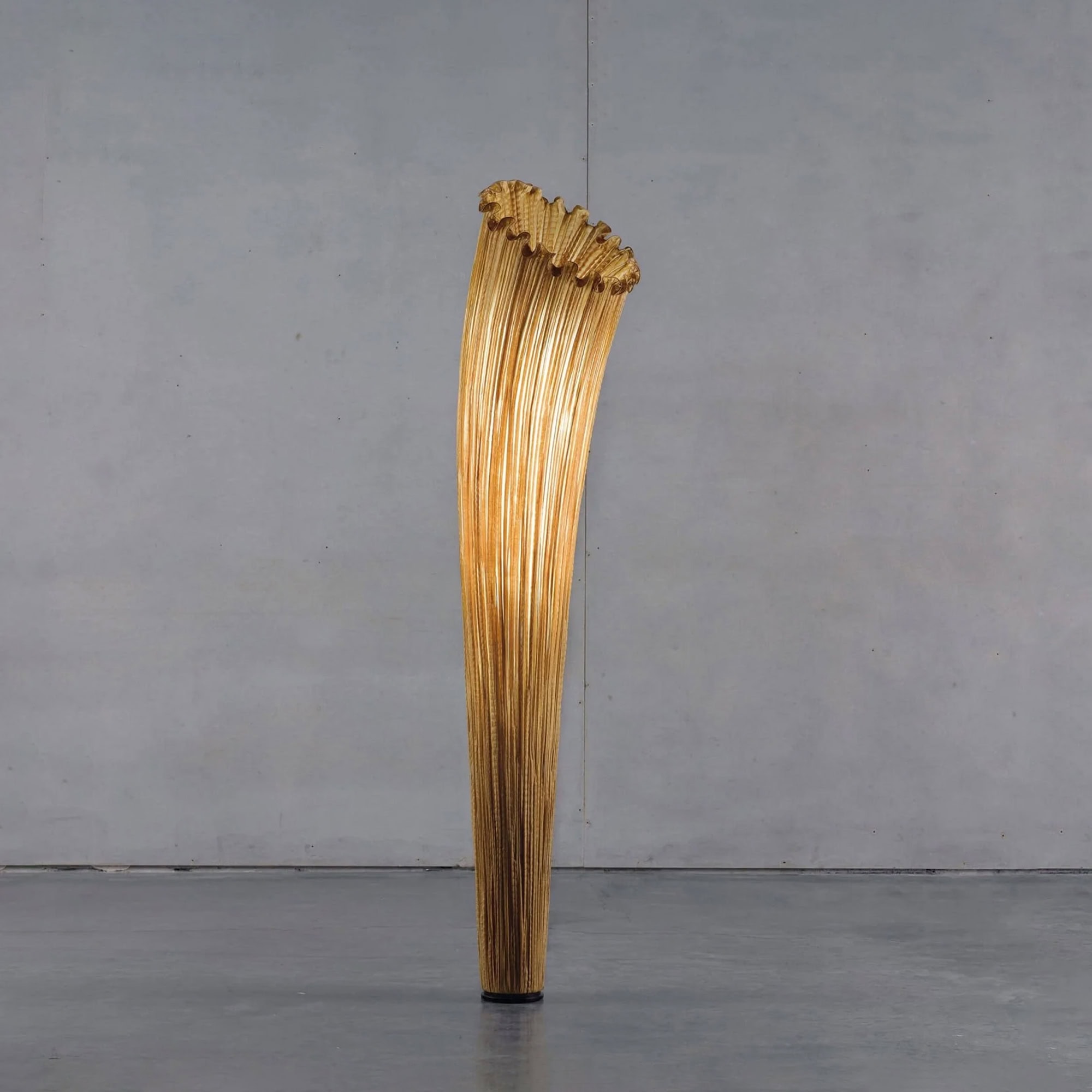 Close-up view of the Aqua Creations Horn Silk Floor Lamp in golden silk finish, highlighting its sculptural design.