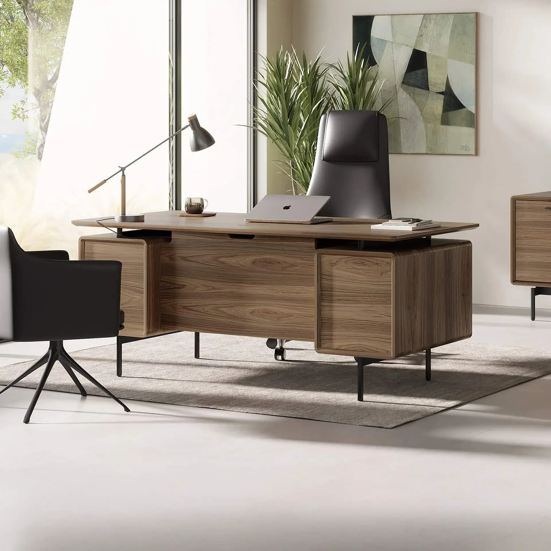 Modern walnut executive desk with black leather chair in office setting.