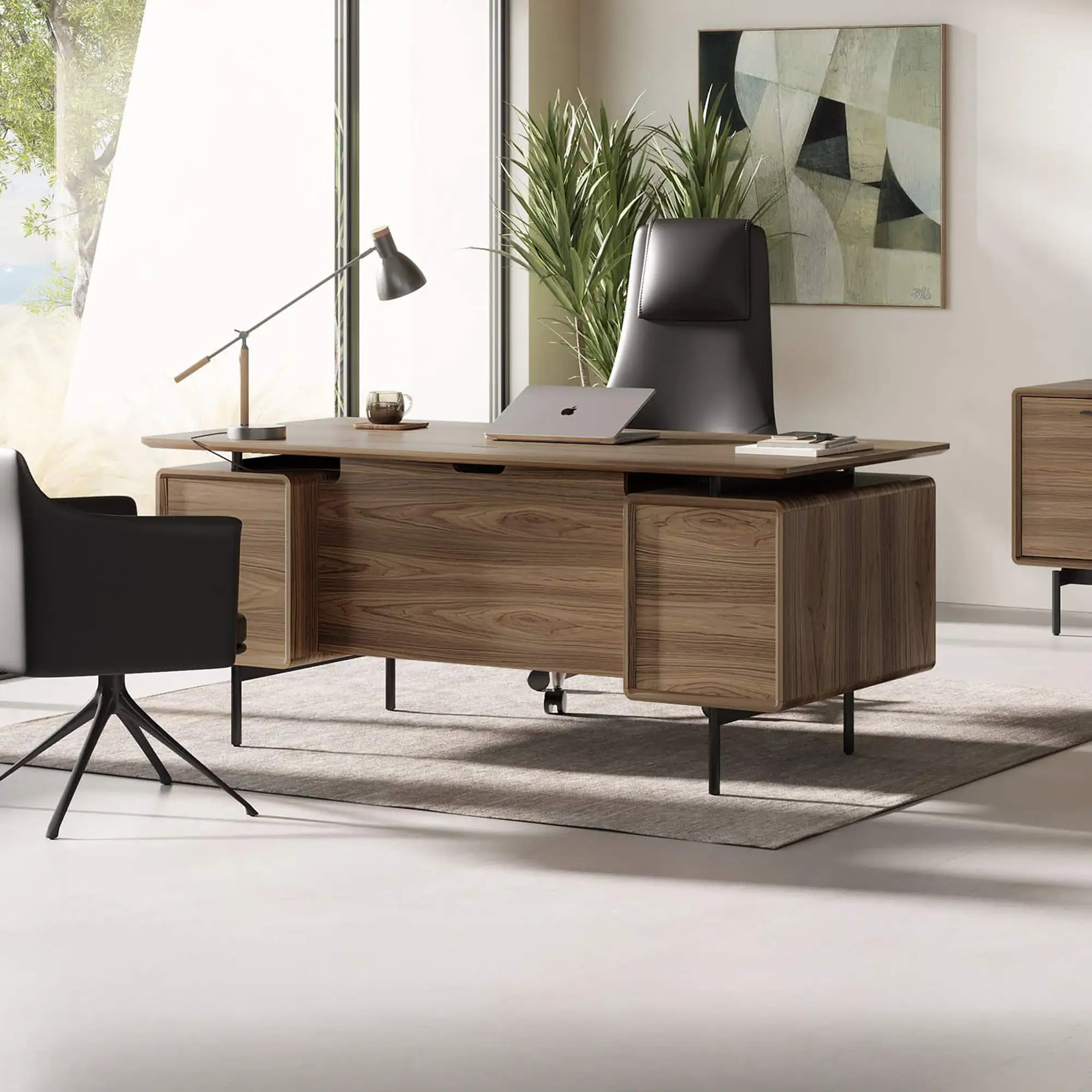 Modern walnut executive desk with black leather chair in office setting.