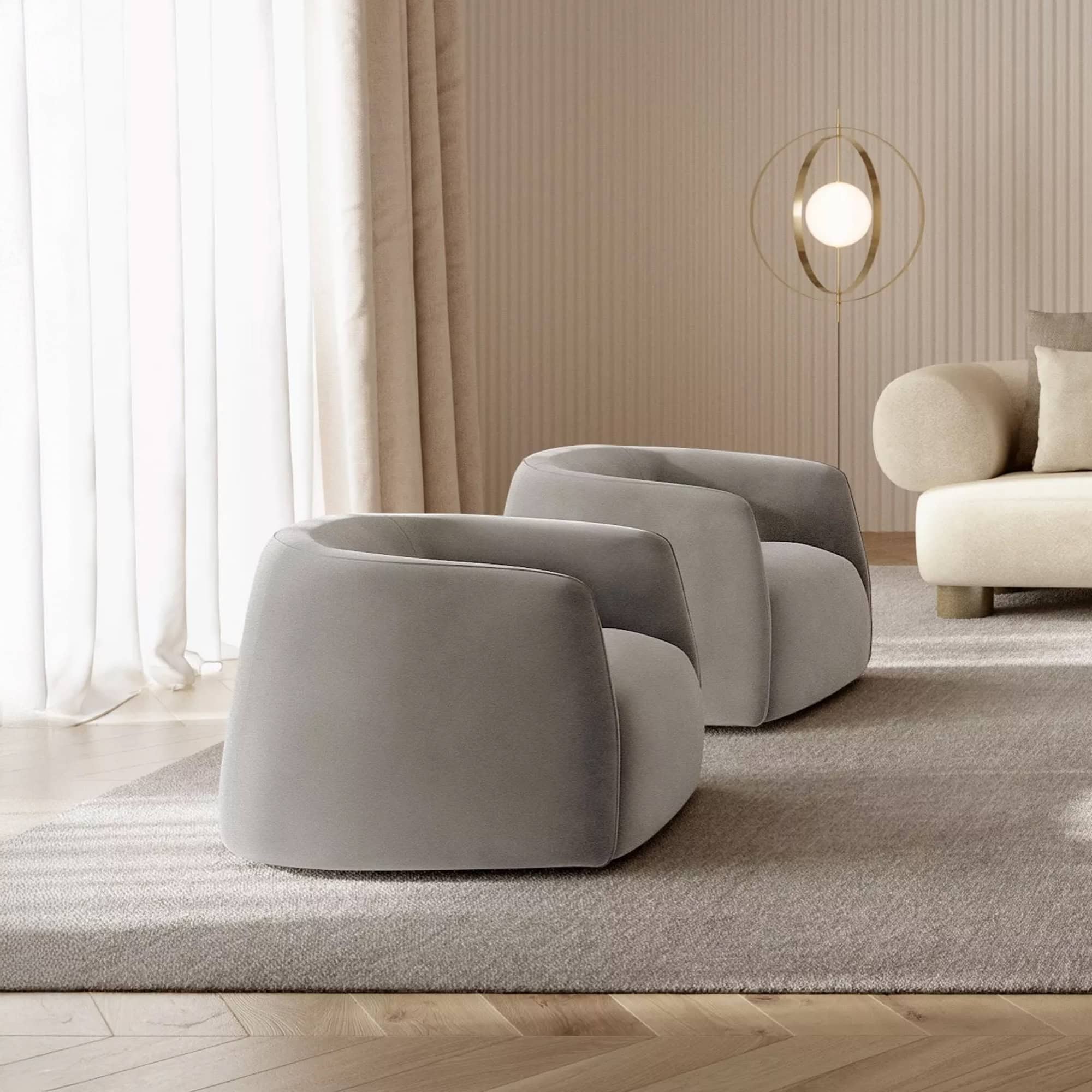 Elegant grey modern chairs in stylish living room setting with neutral decor and lighting.