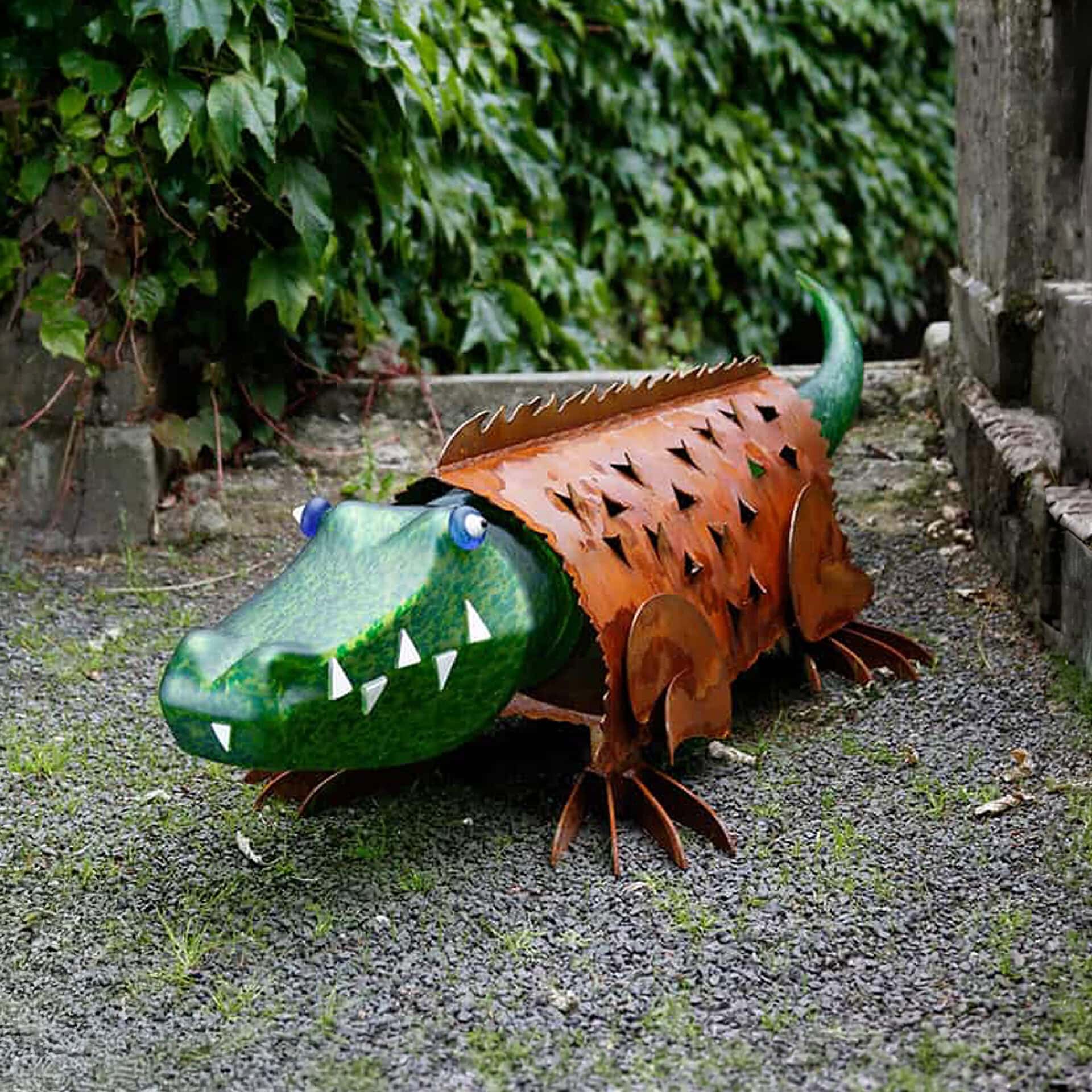 Metal crocodile garden sculpture for outdoor decor.
