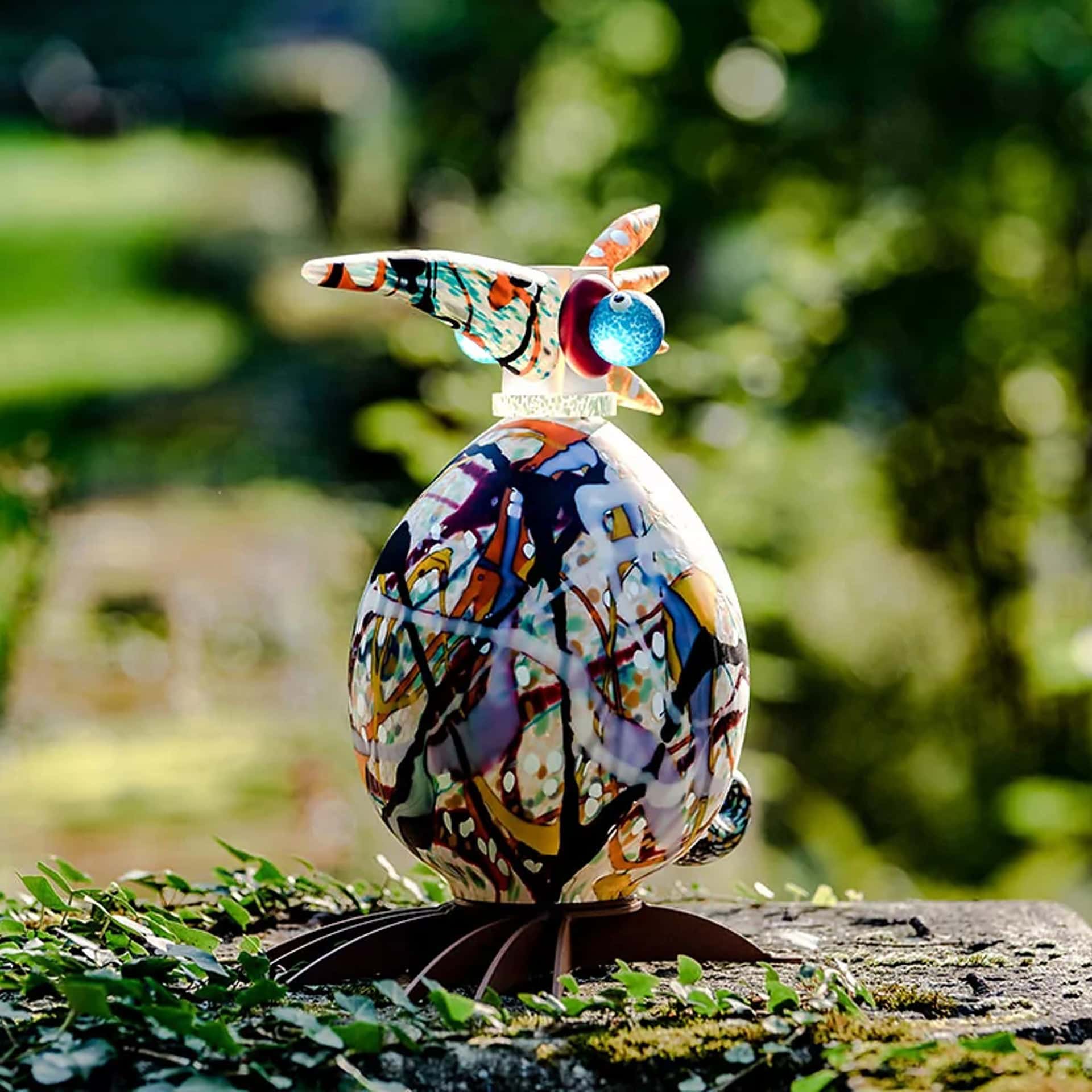 Outdoor decorative bird sculpture for garden lighting.