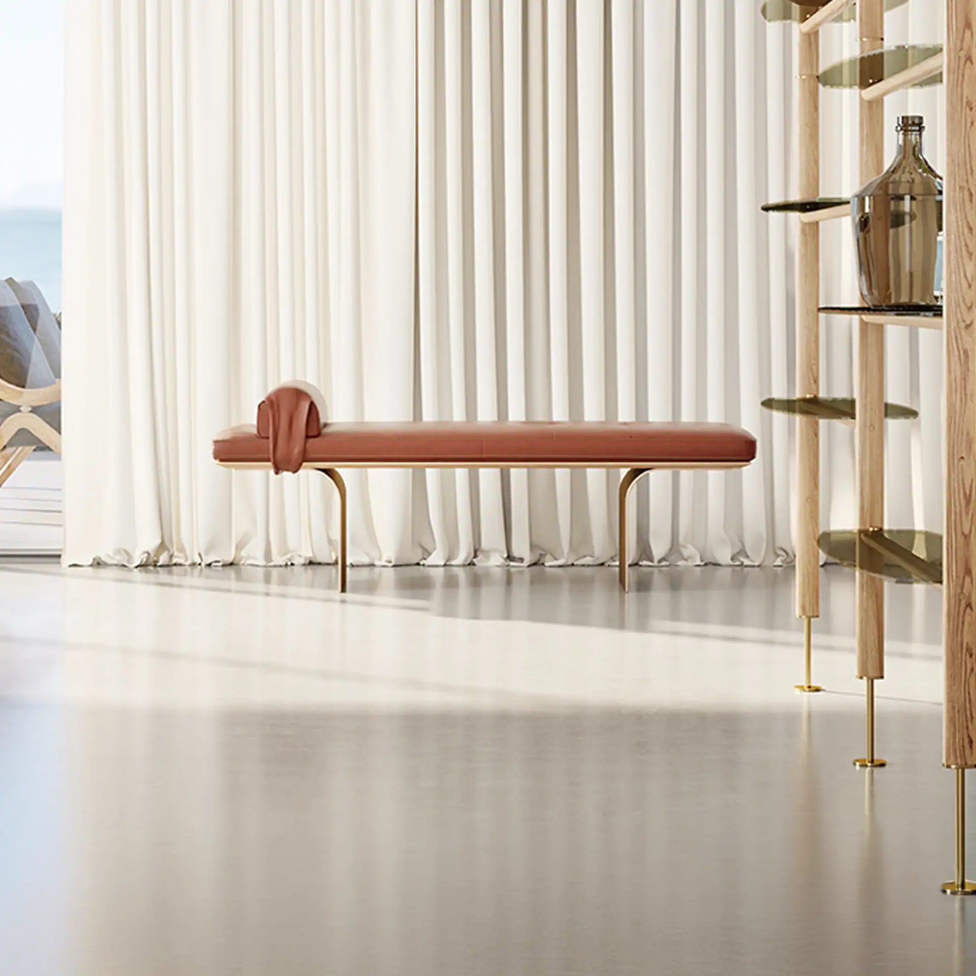 Minerva Bench by Sklar Furnishings in a bright room with curtains and shelves.