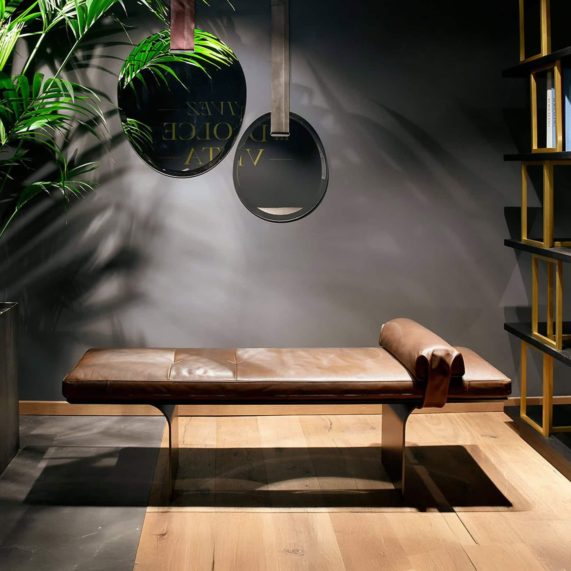 Lifestyle setting of Minerva Leather Bench in a greenery-inspired modern space.