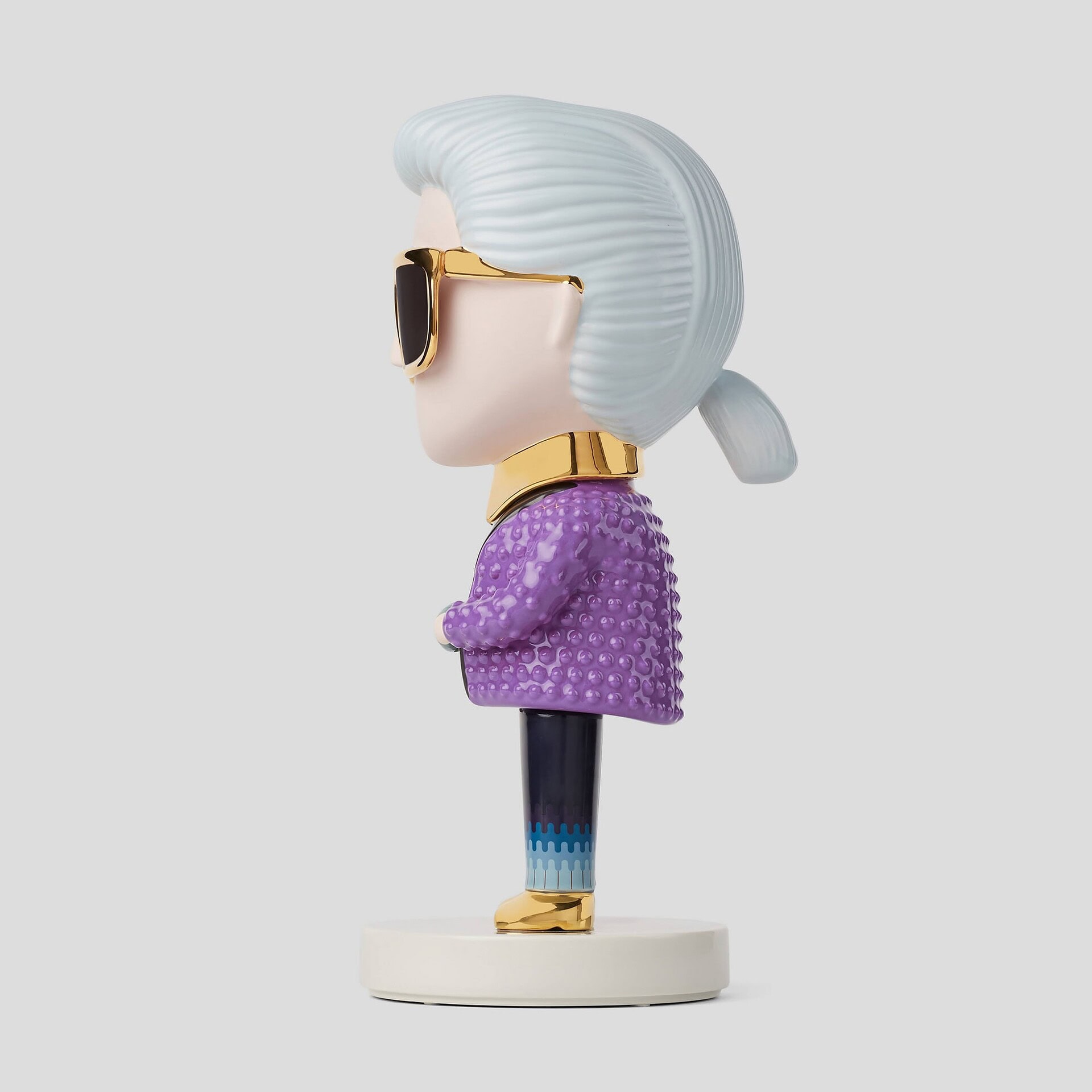 Side profile view of the Karl Lagerfeld Pop Art Sculpture against a plain light gray background.