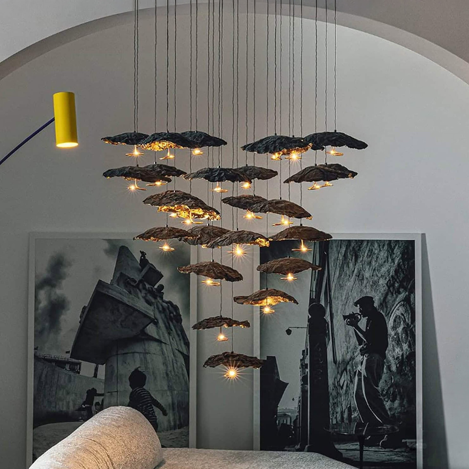 Elegant gold moon-shaped sculptural chandelier for modern interiors.
