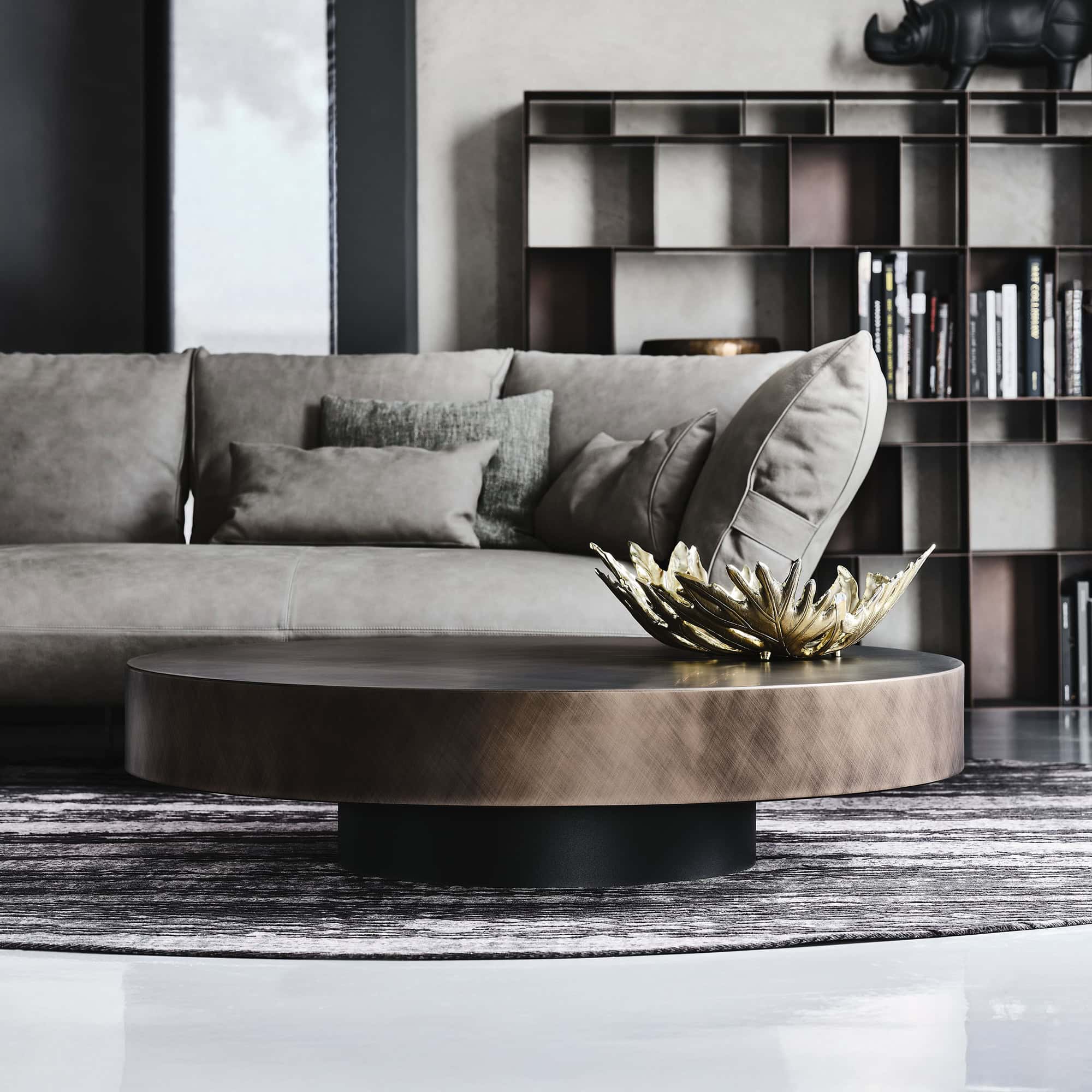 Arena Hand-Brushed Coffee Table finish showcased in a chic lounge area with grey sofa.