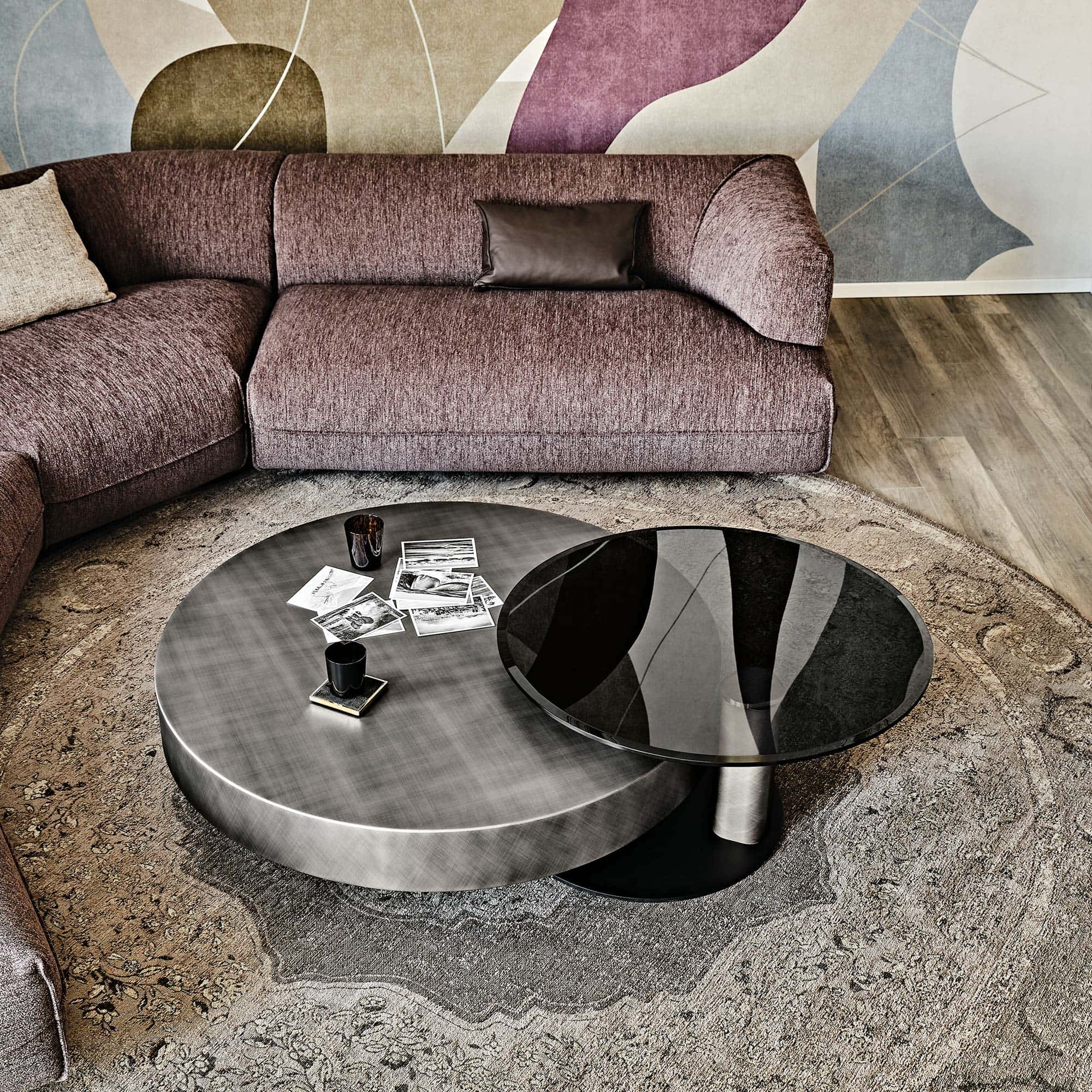 Close-up of Arena Hand-Brushed Coffee Table with brushed bronze wood top styled with decorative centerpiece.