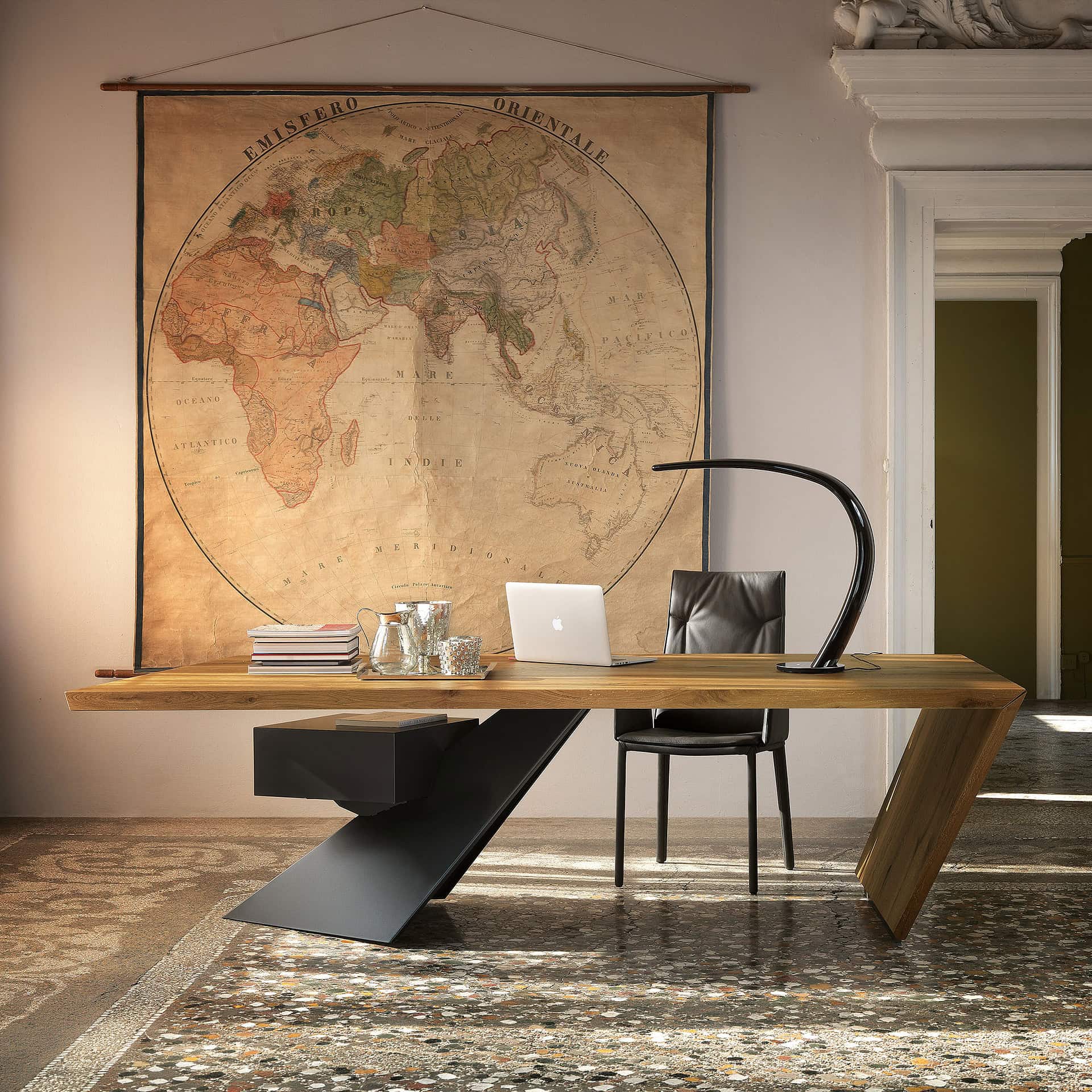 Stylish wooden office desk with sleek black accents and a world map wall art in a professional works.