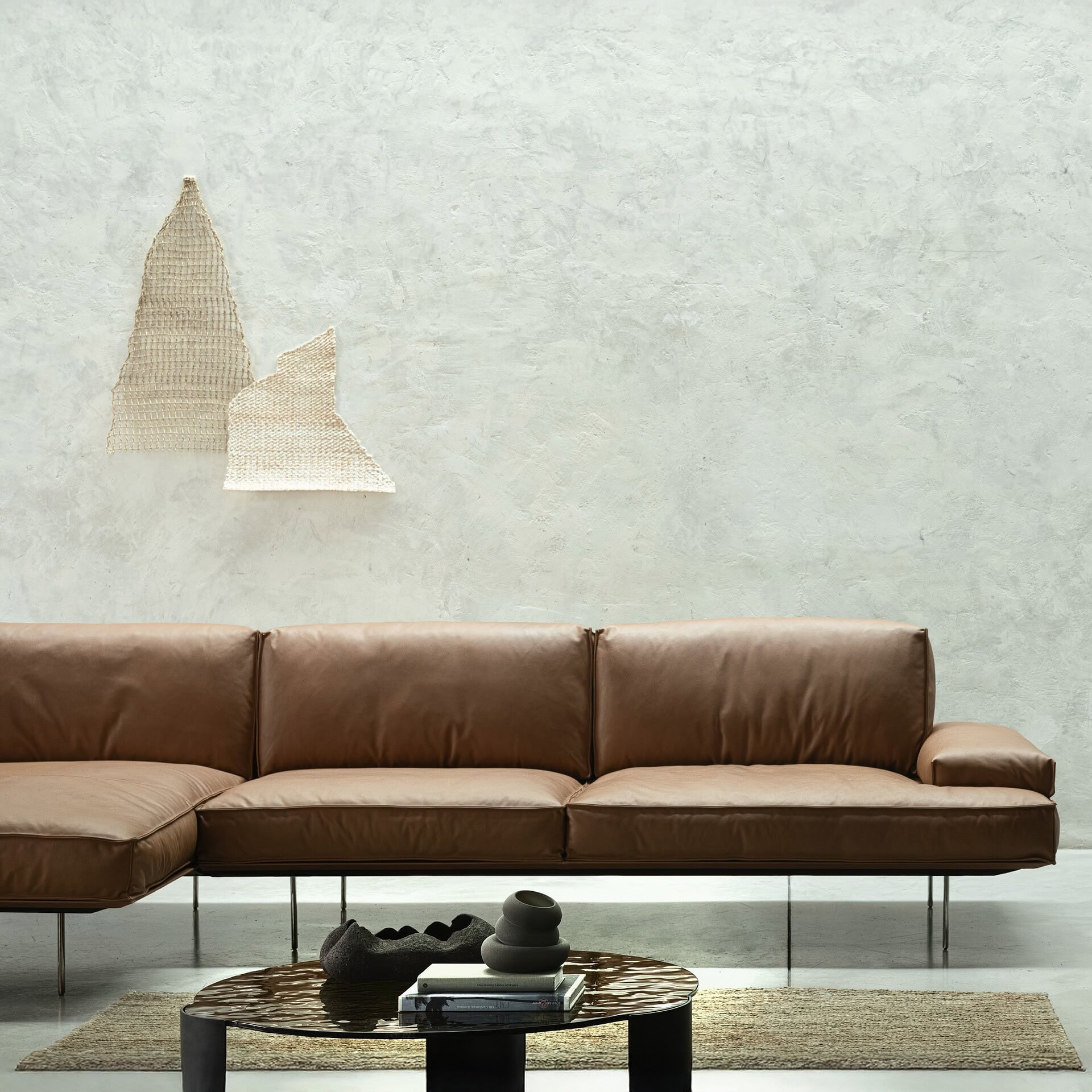 A living room with a couch, chair and table.