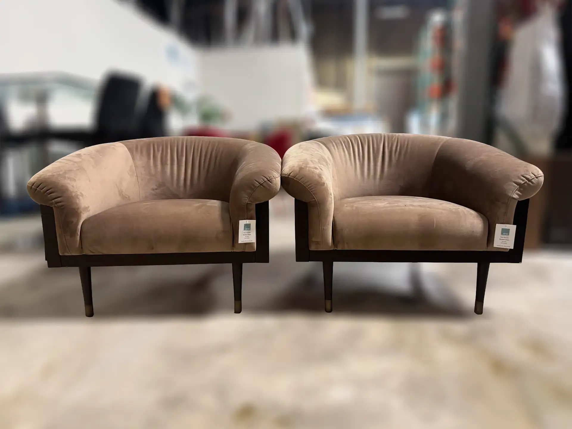 Sklar Furnishings Madison Tub Chairs set of 2 in a showroom.