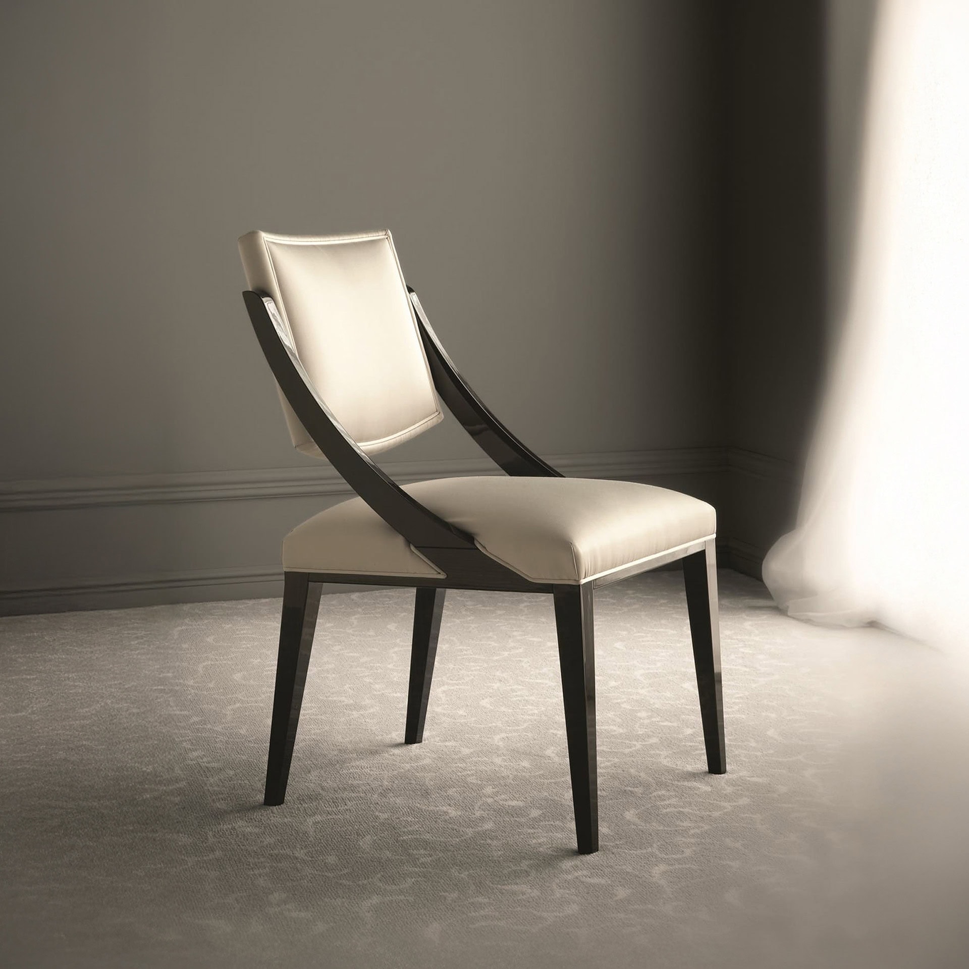 Elegant modern dining chair with cream upholstery and dark wood frame. Perfect for contemporary dini.