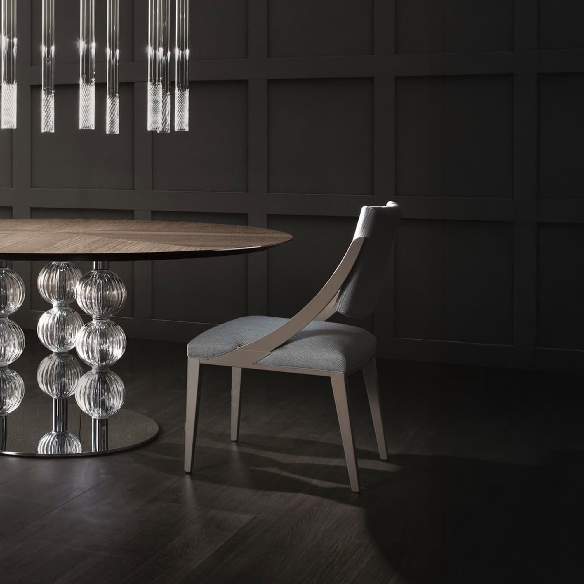 Memory Dining Chair styled in a contemporary dining room setting with dark wood flooring.