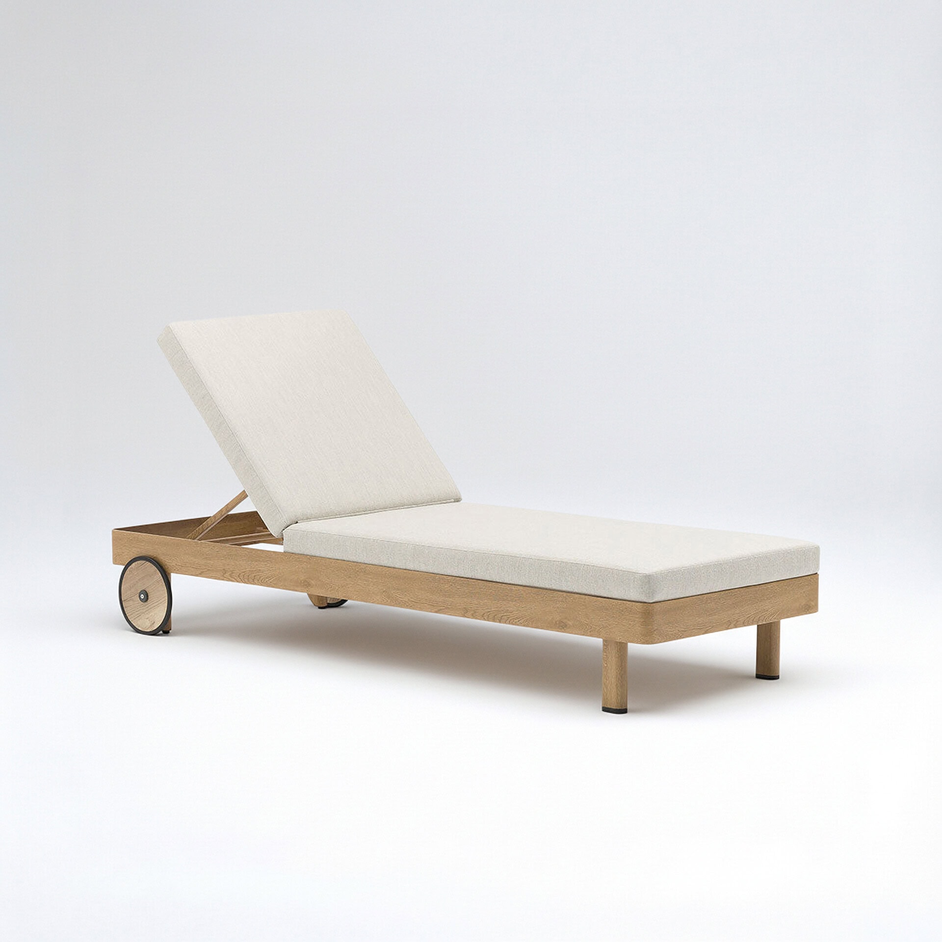 Studio image of the Couture Jardin Lounge Chaise Lounge with oak-finish aluminum frame and light cushioned seat, shown on a white background.