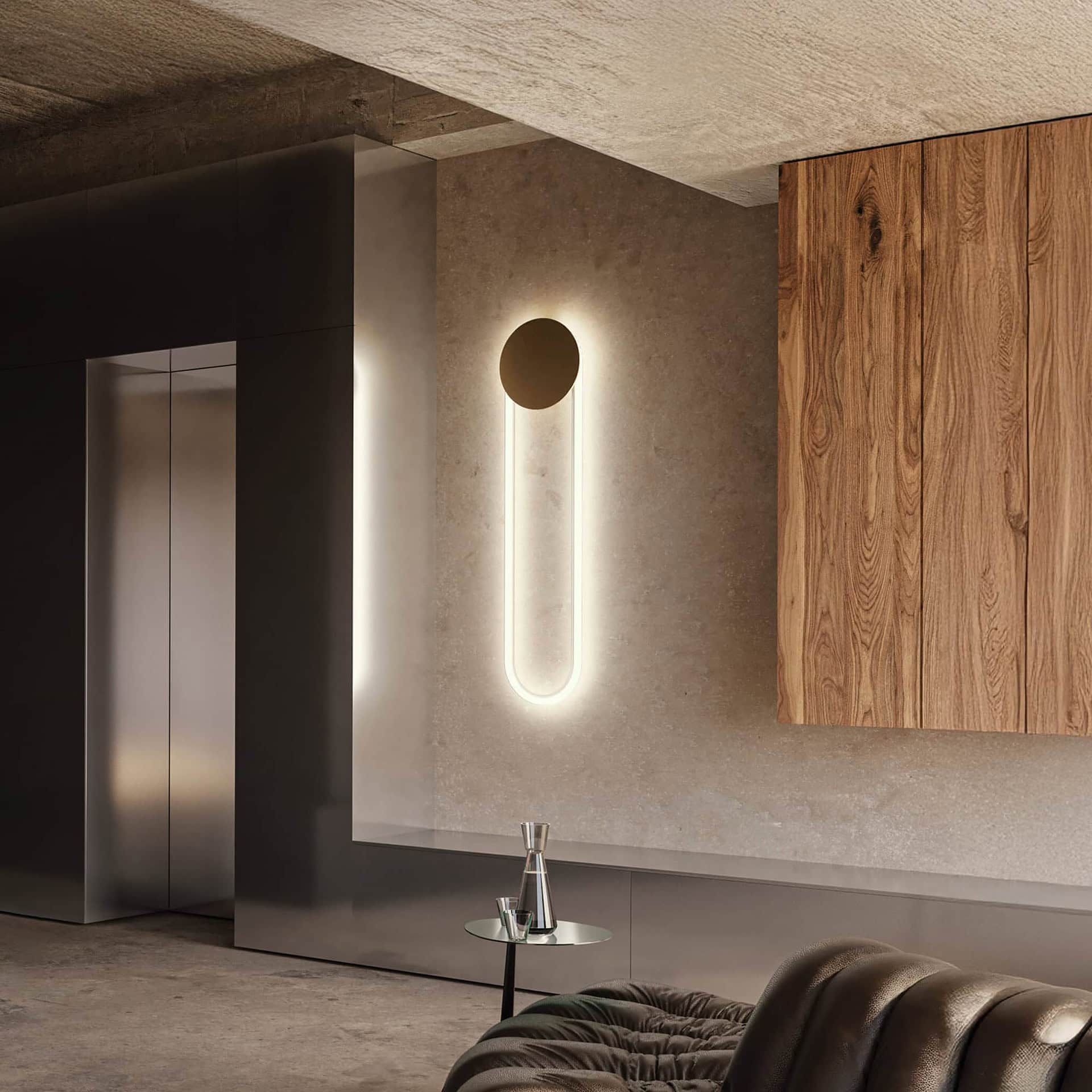 RA Sculptural LED Wall Sconce in a modern interior, glowing with a warm circular halo effect.