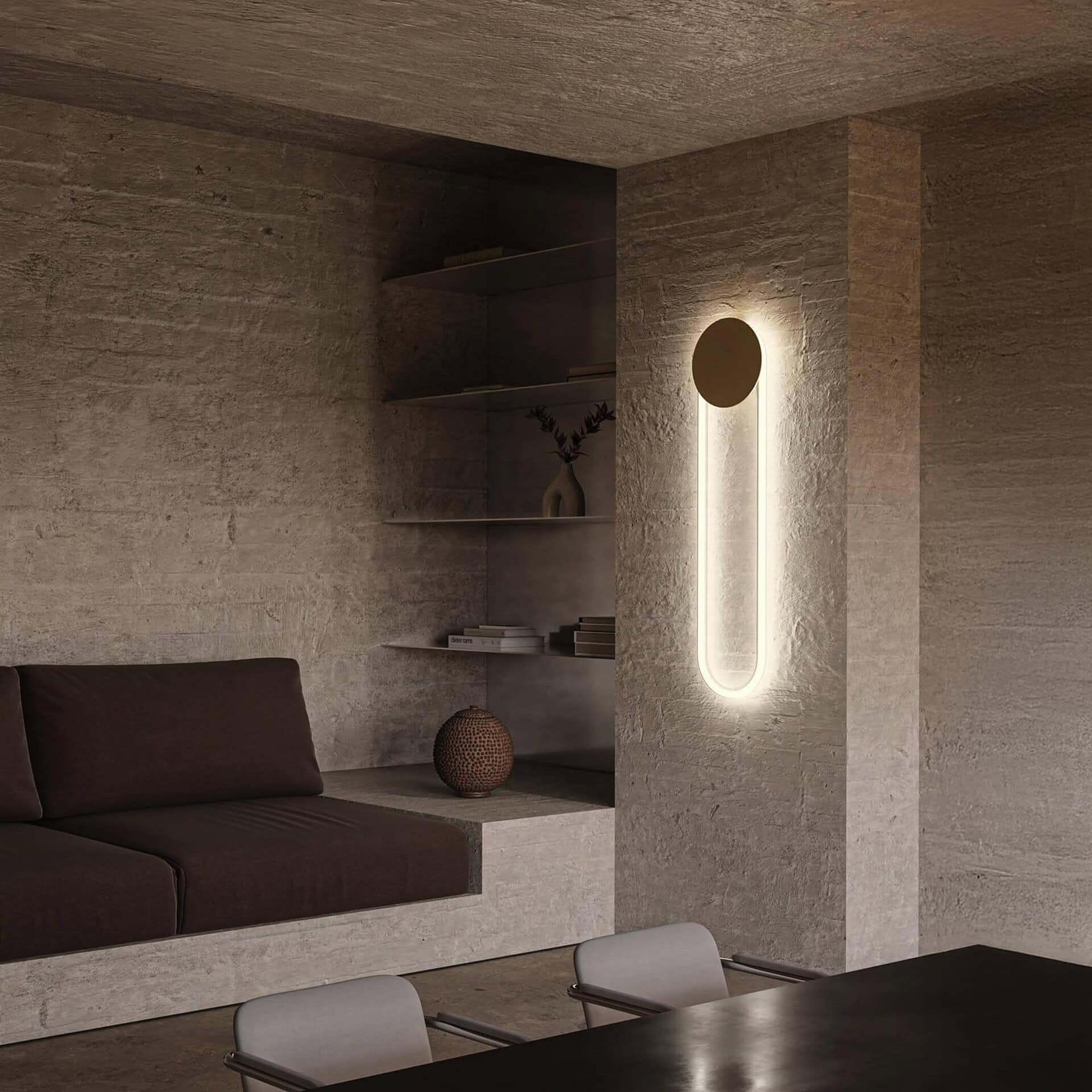 Sleek modern wall light fixture with LED strip on textured stone wall interior design.