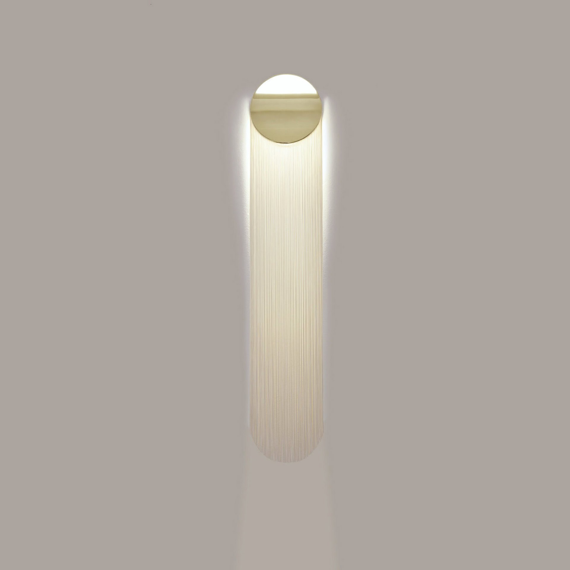 Soft LED wall sconce with modern minimalist design for contemporary home decor.
