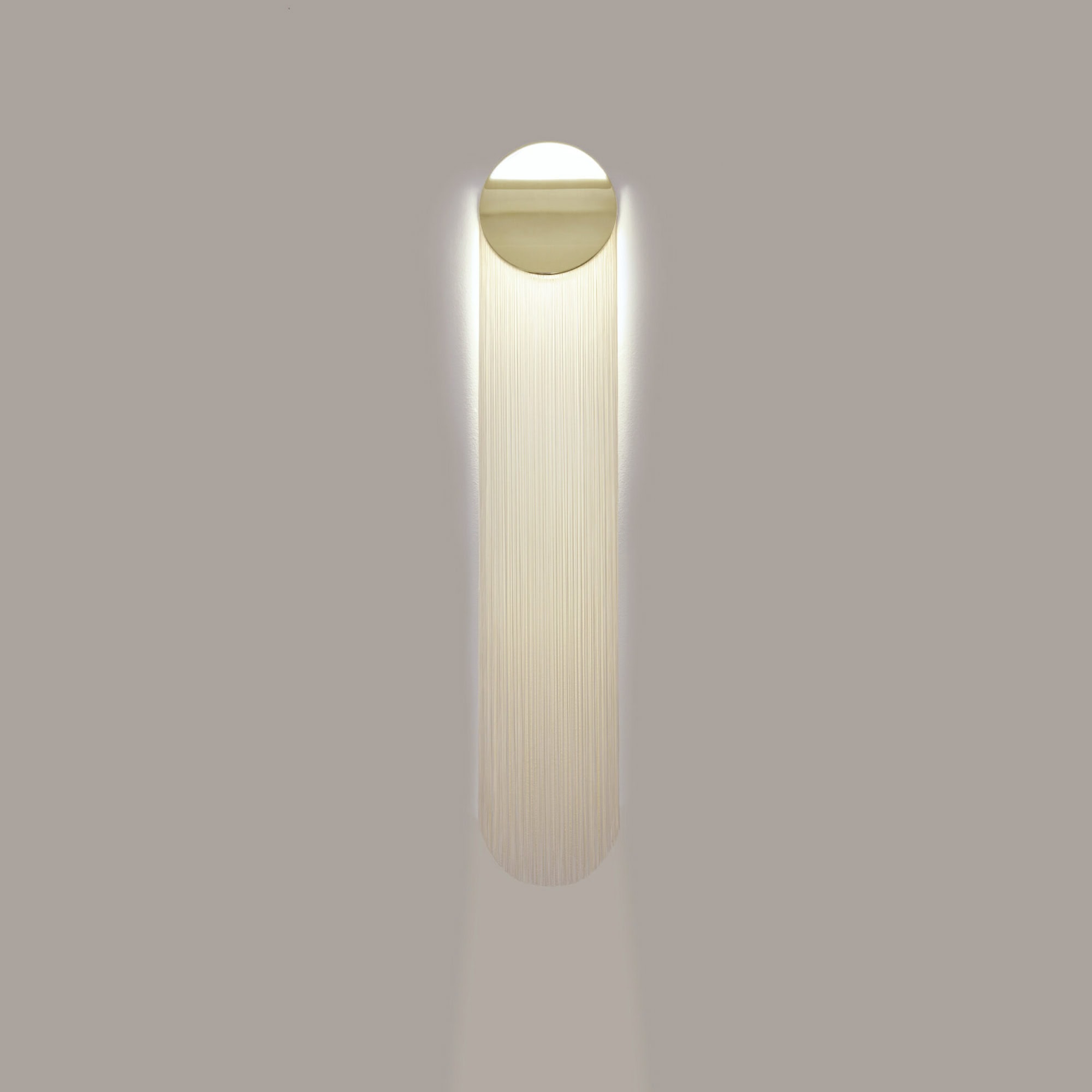Soft LED wall sconce with modern minimalist design for contemporary home decor.