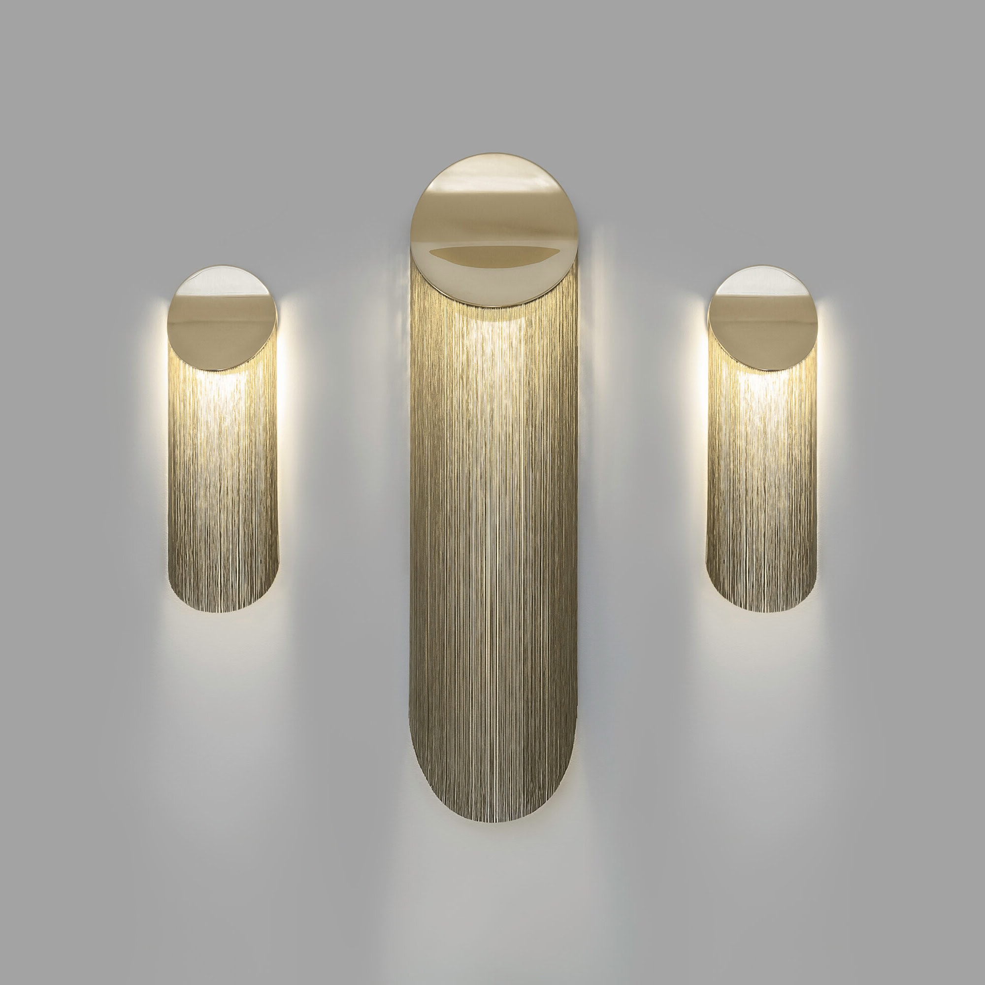 Elegant modern wall sconces with gold accents, ideal for upscale interior decor.