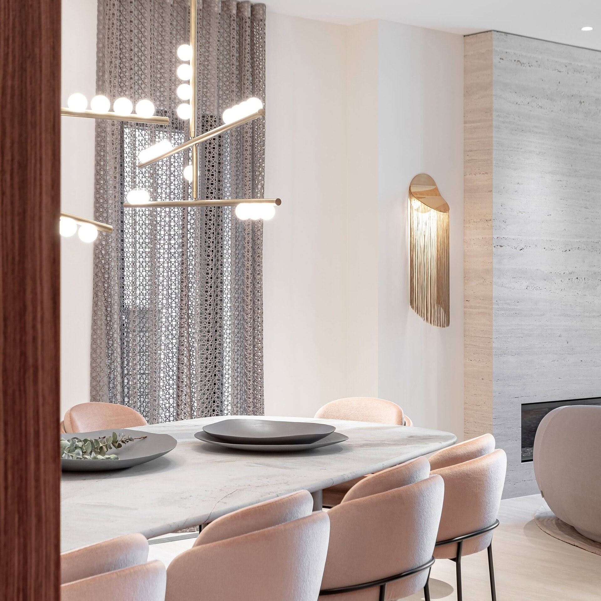 Modern dining room with elegant Sklar Furnishings table and chairs, contemporary lighting, and stylish design.