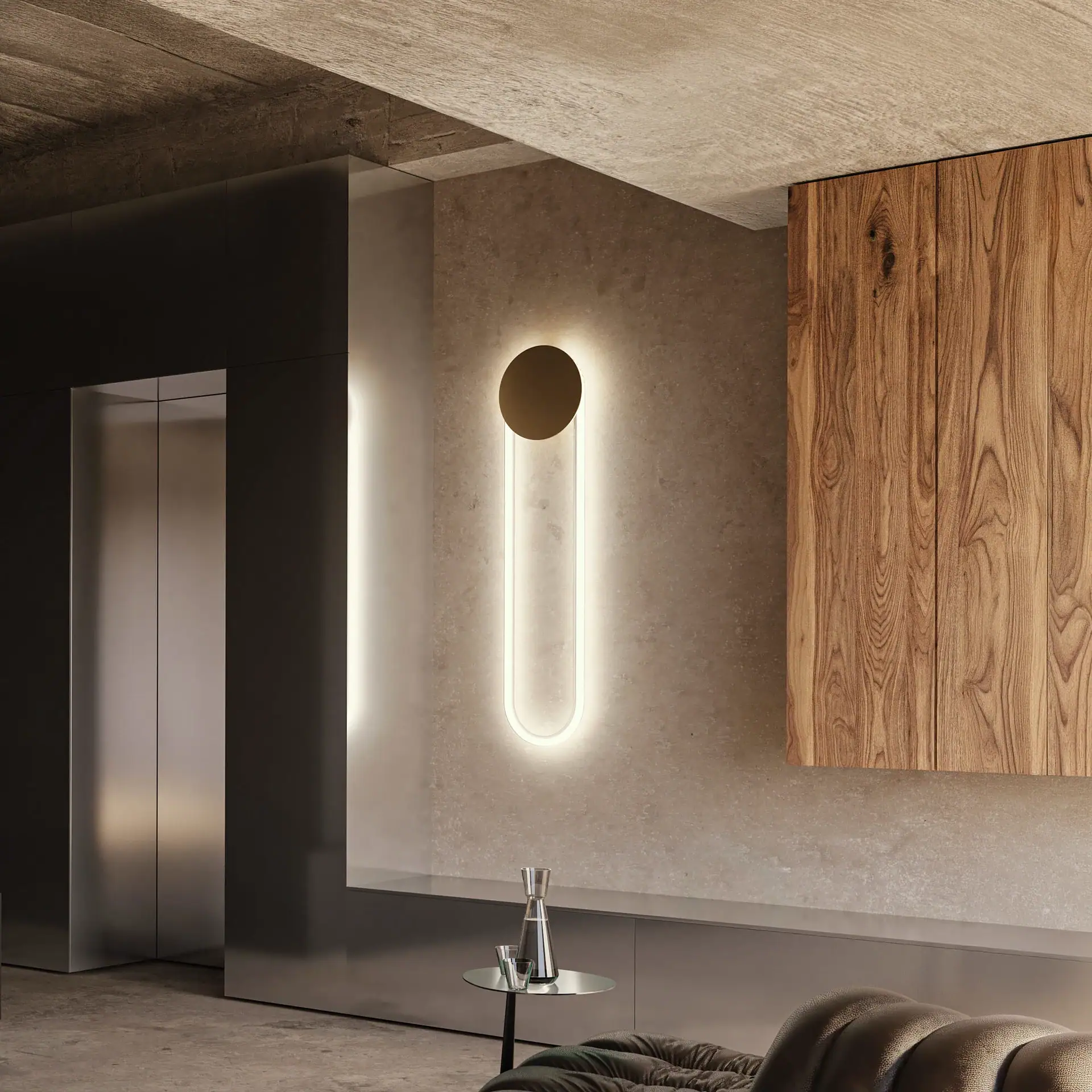 Modern wall sconce with circular and elongated design in a contemporary interior.
