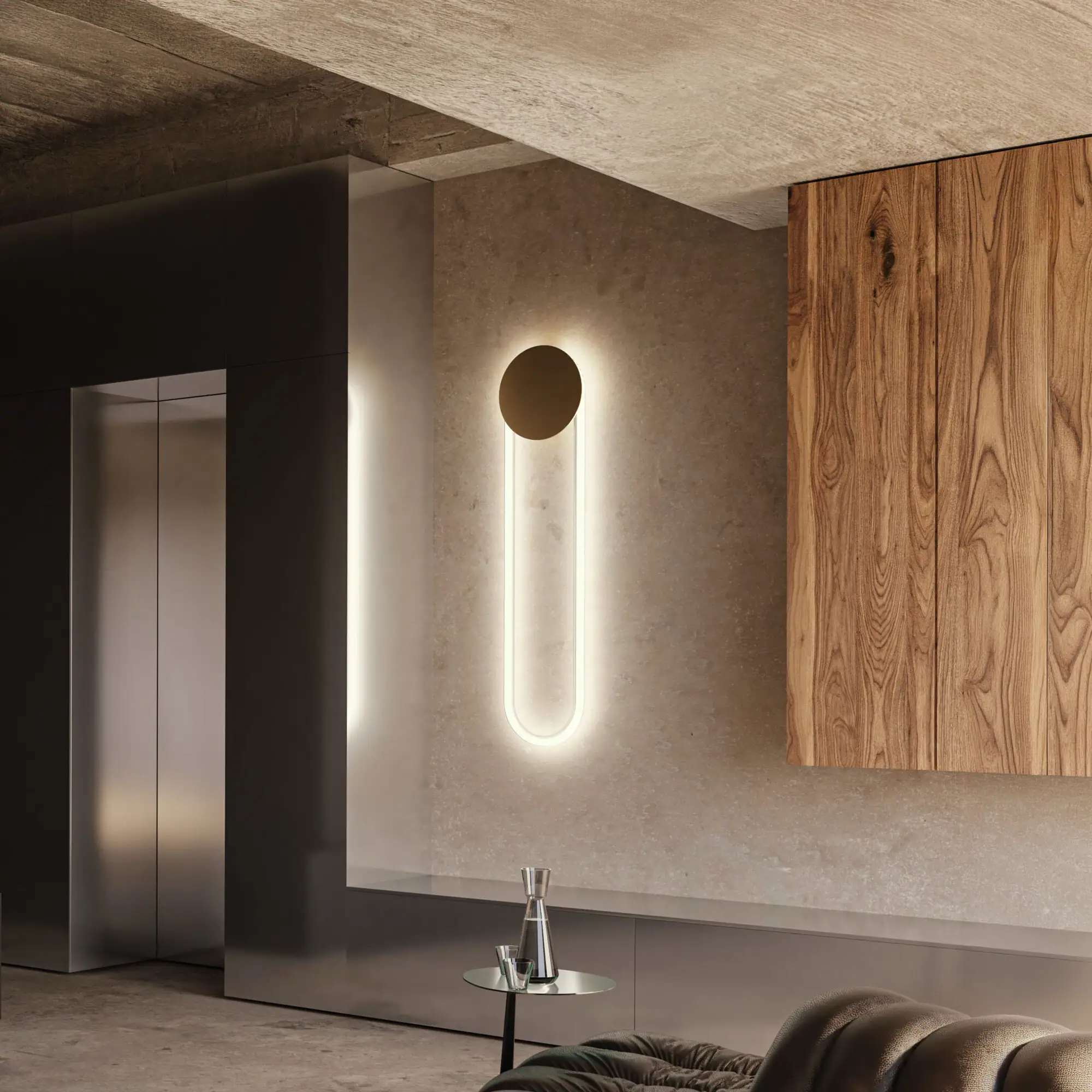 Modern wall sconce with circular and elongated design in a contemporary interior.