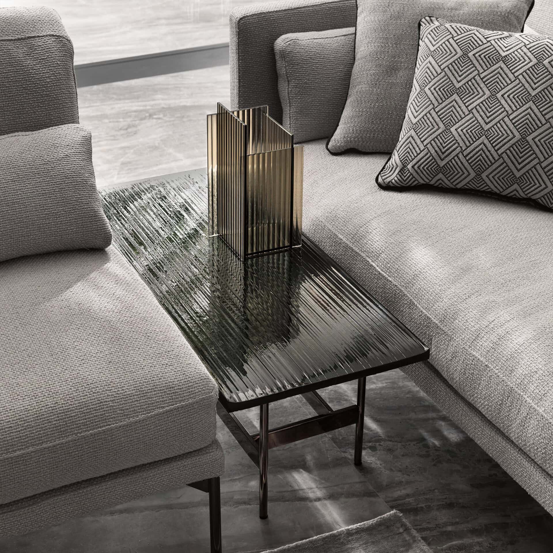 Contemporary living room with sofa and decorative accents.