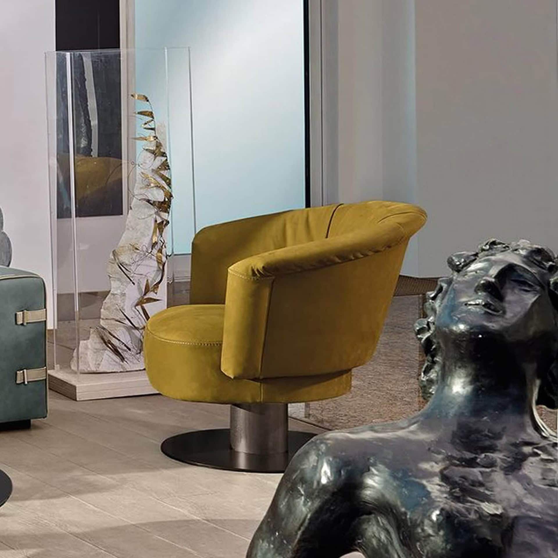 Gamma Luna Armchair in mustard yellow leather with swivel base, styled in a contemporary living space.