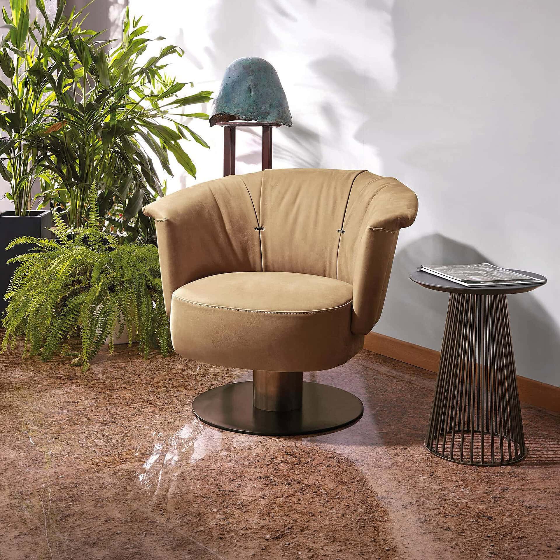 Gamma Luna Armchair in mustard yellow leather with swivel base, styled in a modern living room setting.