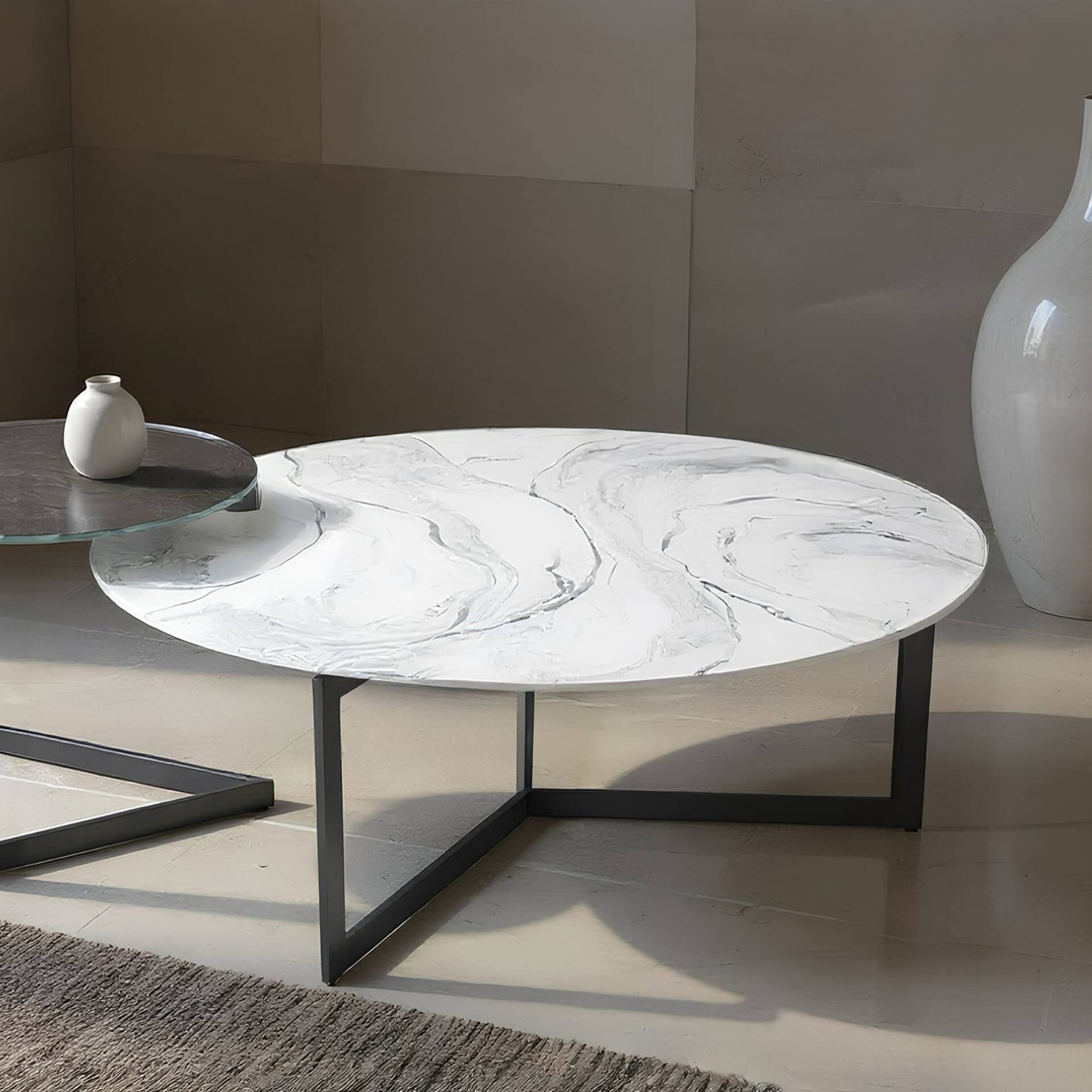 Elegant marble top glass coffee table with black metal frame.