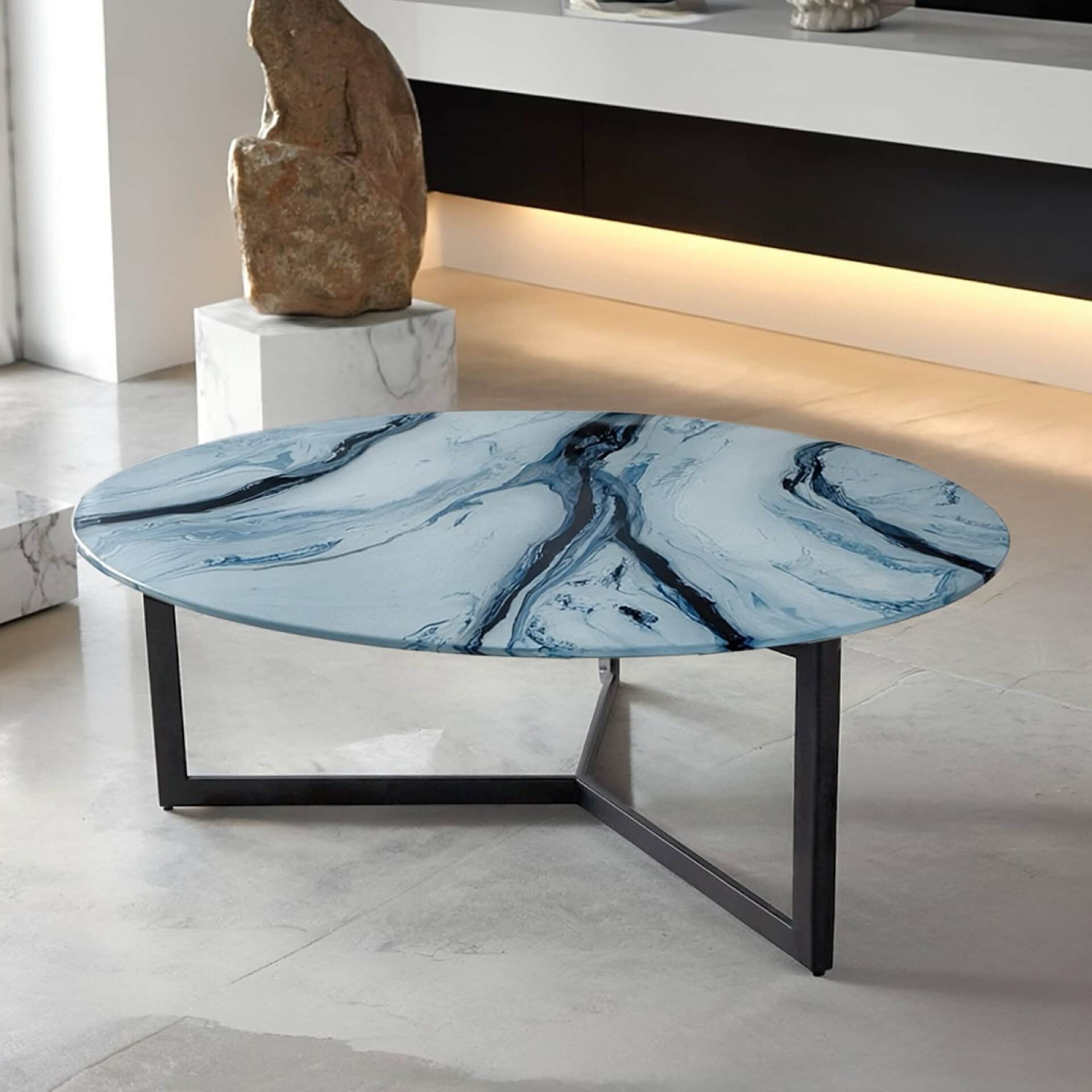 Elegant blue marble glass coffee table with black metal frame.