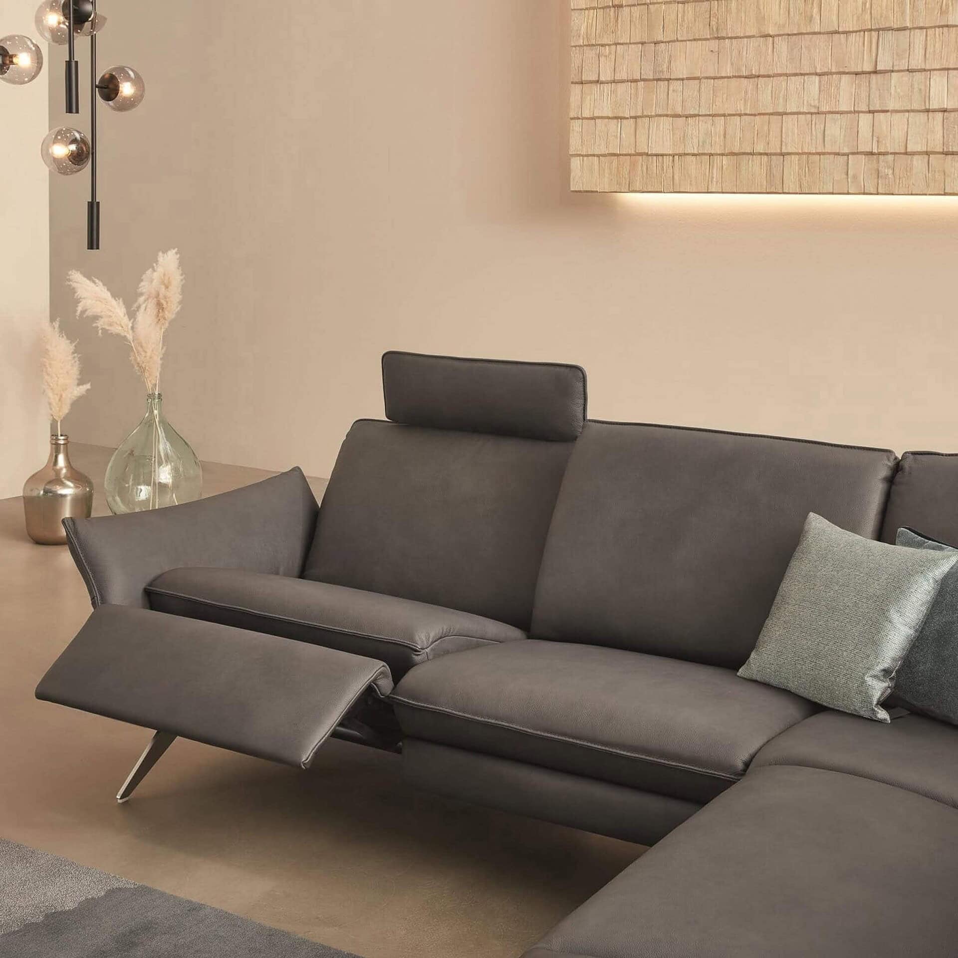 Siegfried 6902 Reclining Sofa in charcoal grey upholstery with adjustable headrests.
