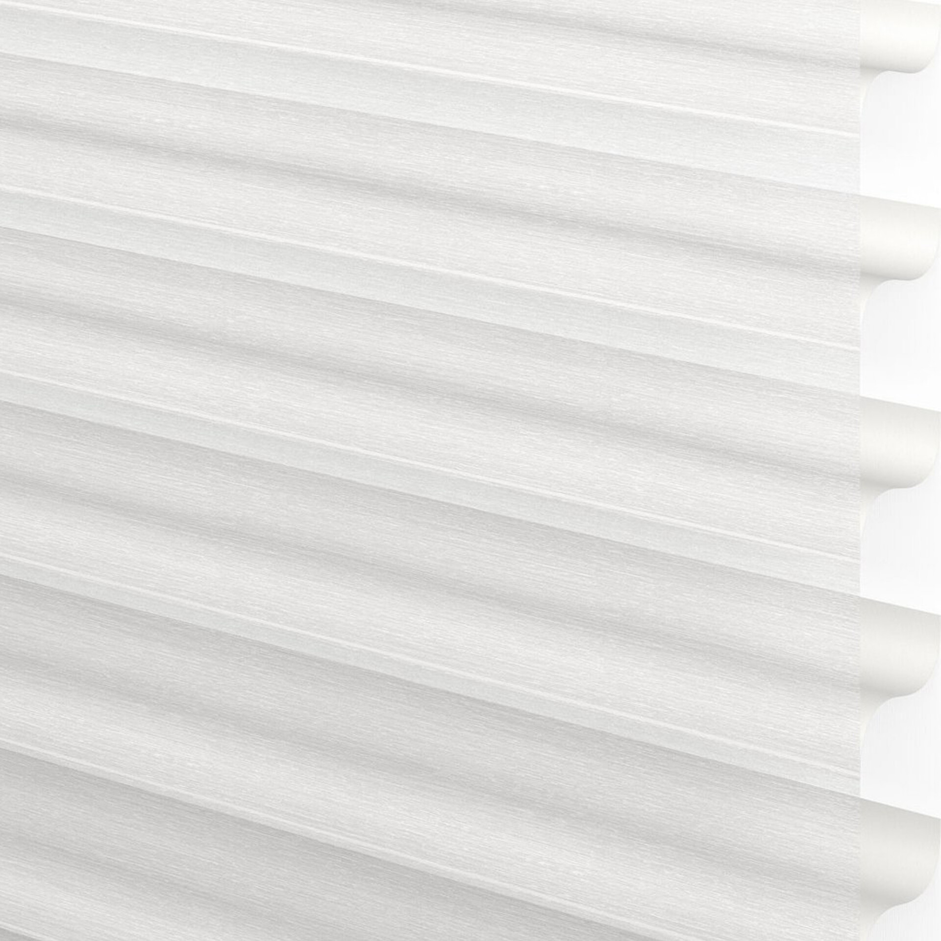 Close-up of white pleated window blinds with a subtle horizontal texture and rounded edges on the right side.