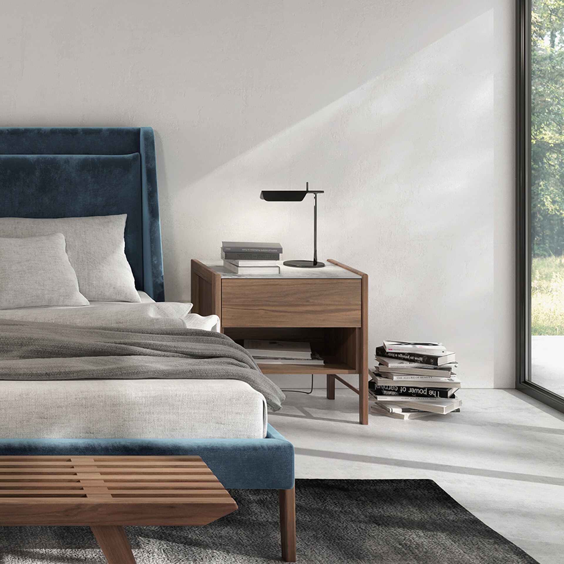 Luxurious bedroom with velvet upholstered headboard and sleek wooden side table, perfect for contemporary interior design.