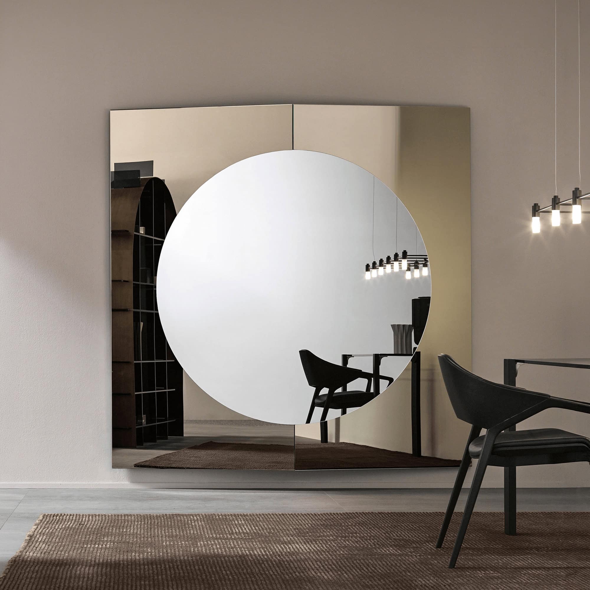 Large round mirror with sleek design, perfect for contemporary home decor.