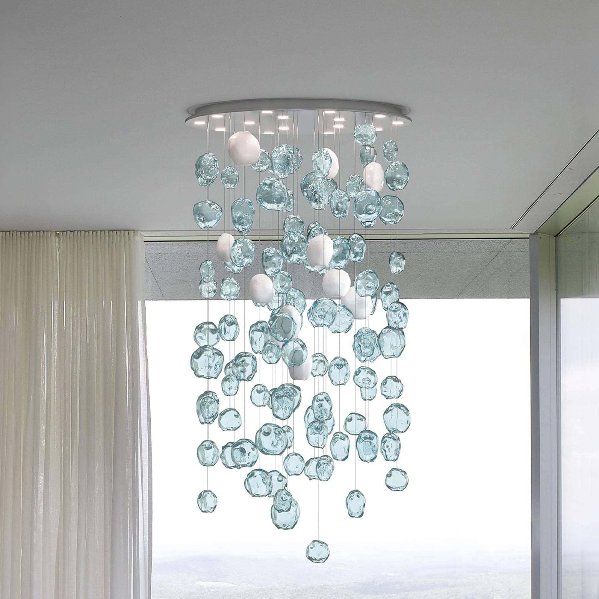 Luxurious glass chandelier with white accents, perfect for upscale interior decor.