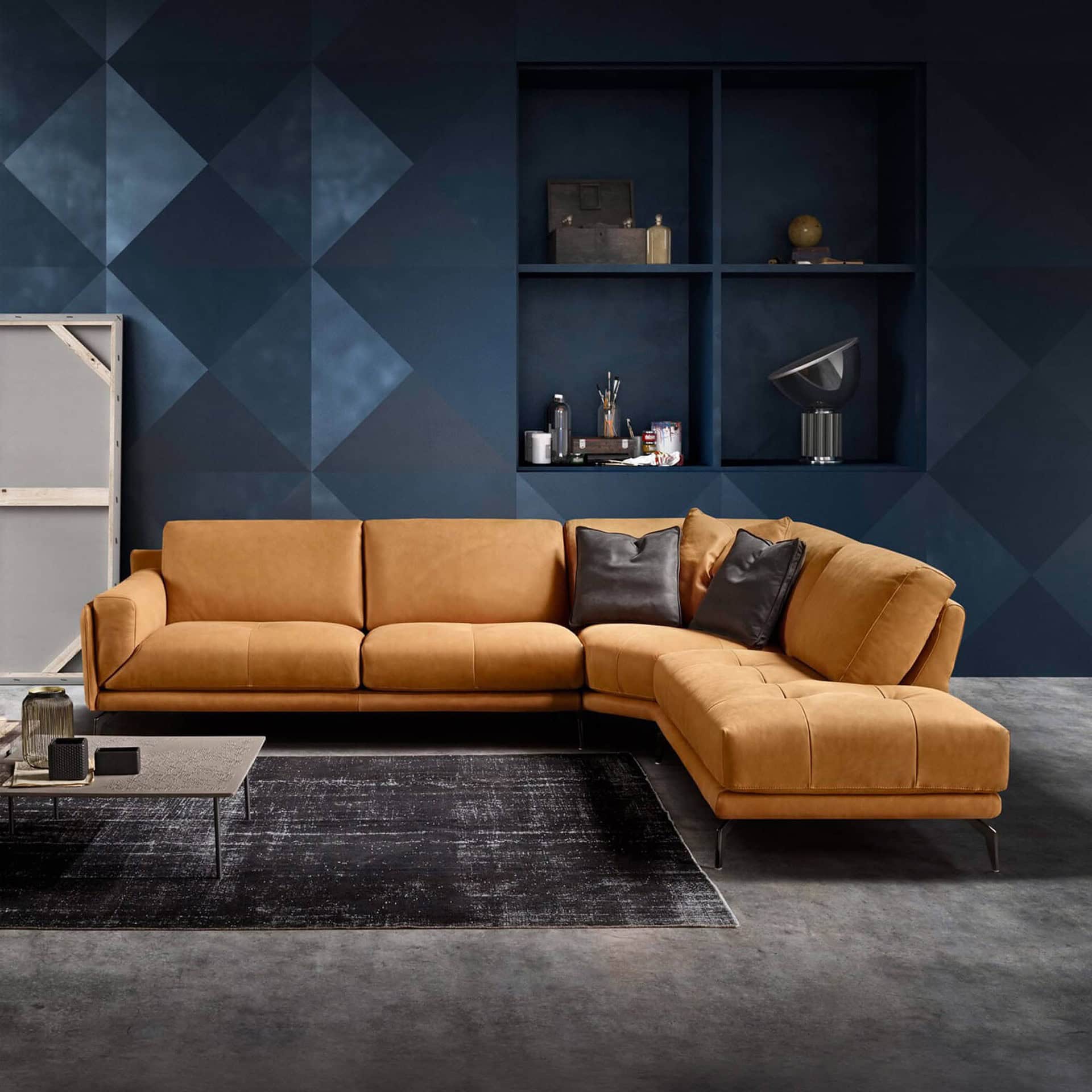 Tan leather Bracci sectional sofa with sleek design in contemporary living room setting.