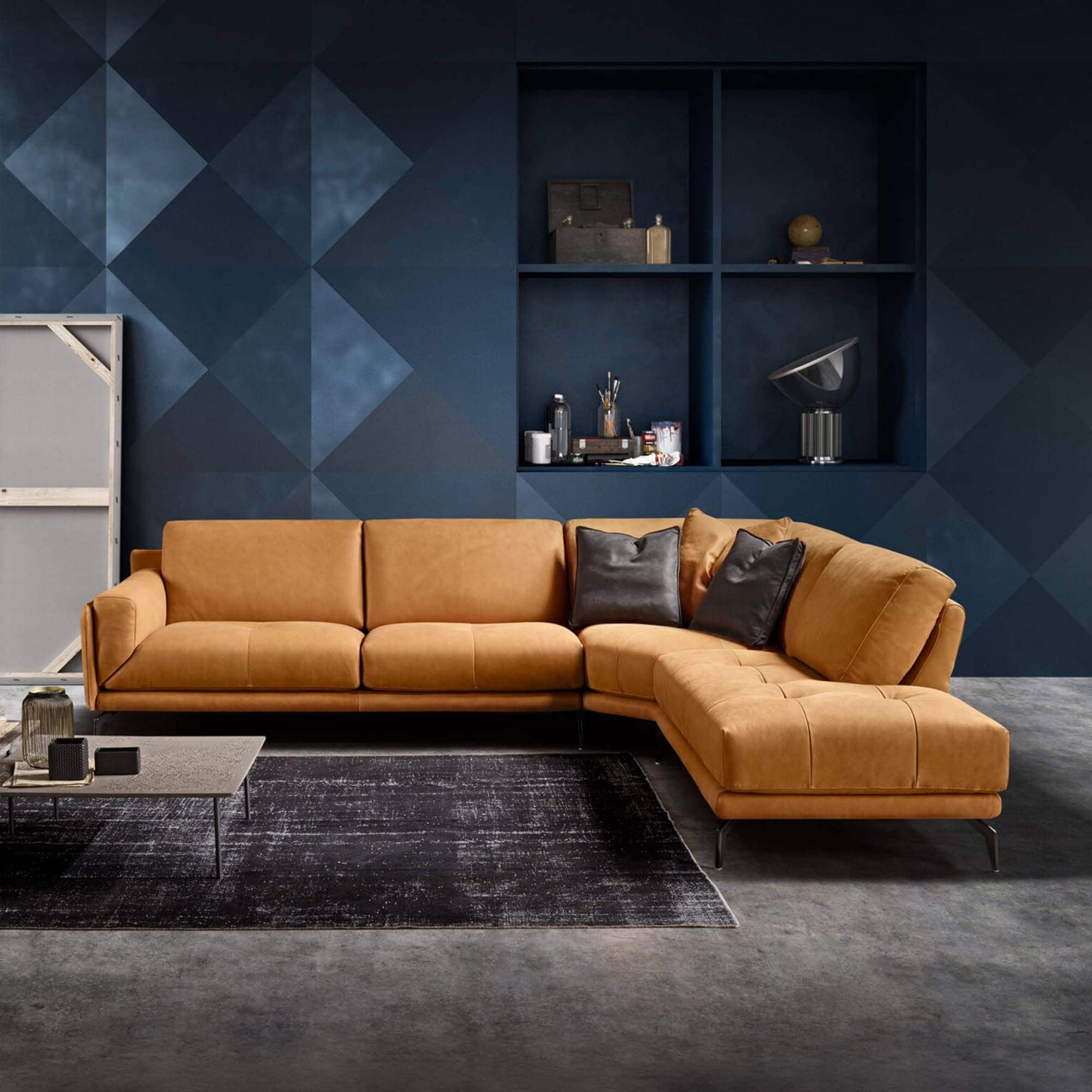 Tan leather Bracci sectional sofa with sleek design in contemporary living room setting.