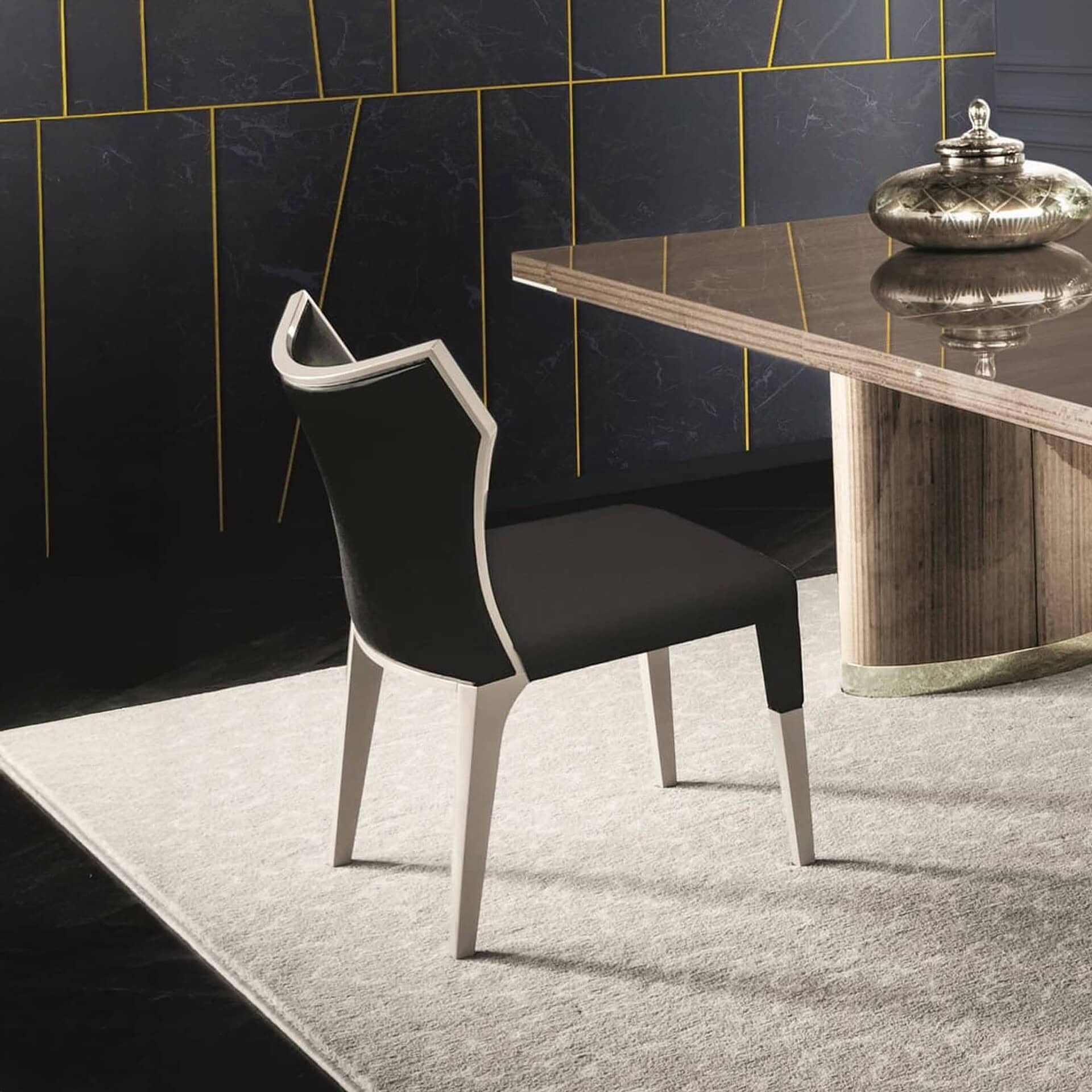 Modern black and white dining chair with sleek design.